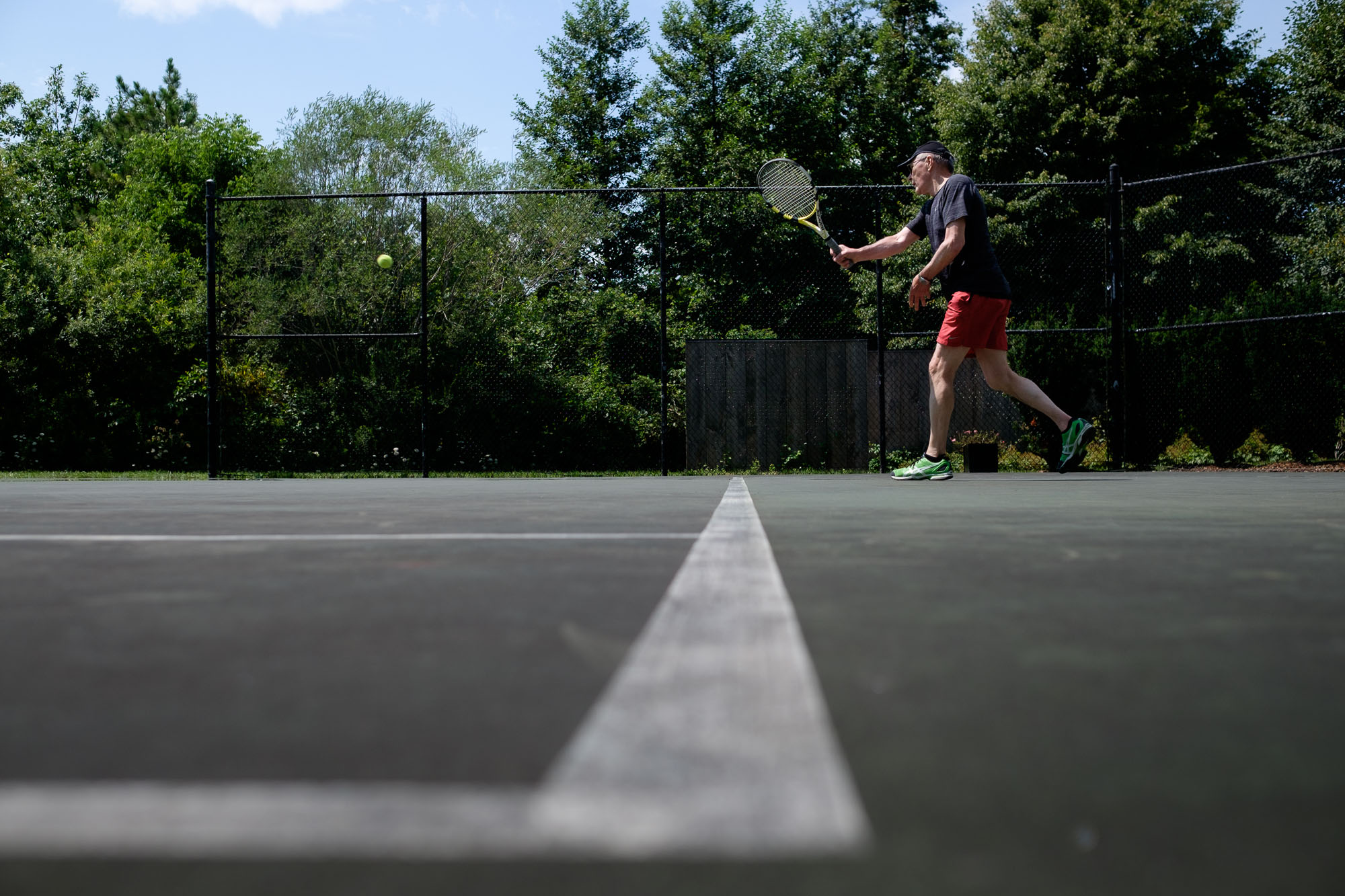  Robert enjoys a game of tennis before his wedding ceremony at Langdon Hall in Cambridge, Ontario by Scott Williams. 