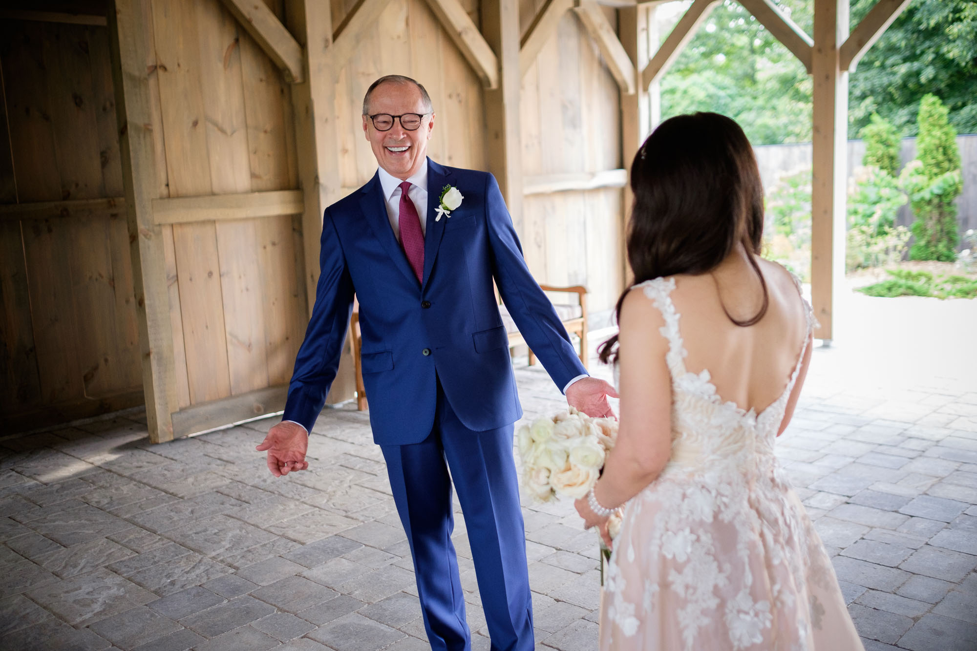  Robert reacts to seeing Teresa in her wedding dress for the first time at Langdon Hall in Cambridge, Ontario by Scott Williams. 