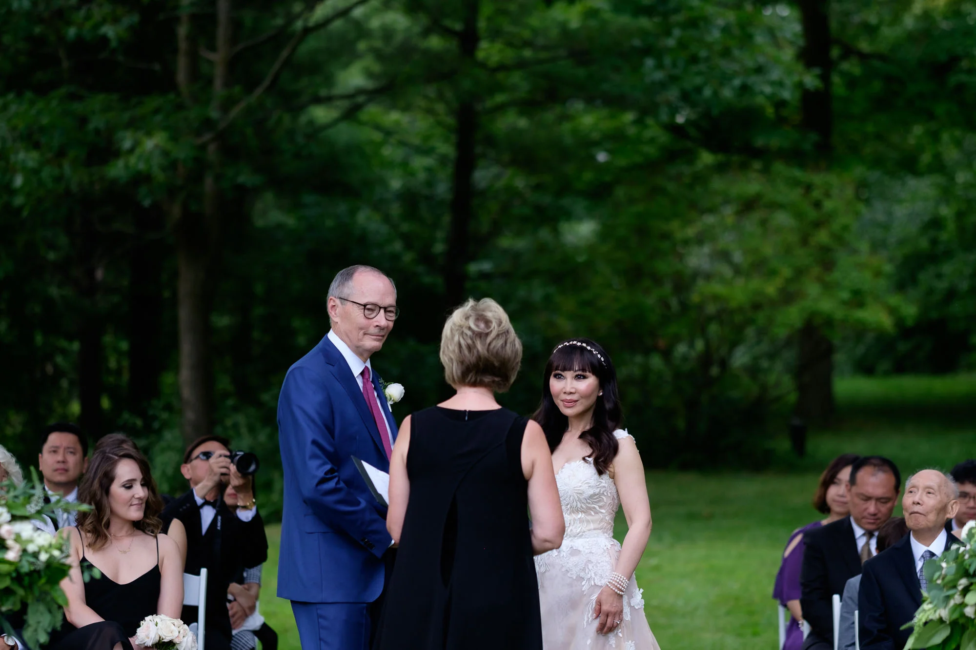 Robert and Teresa exchange wedding vows during their intimate outdoor wedding ceremony at Langdon Hall in Cambridge, Ontario by Scott Williams.