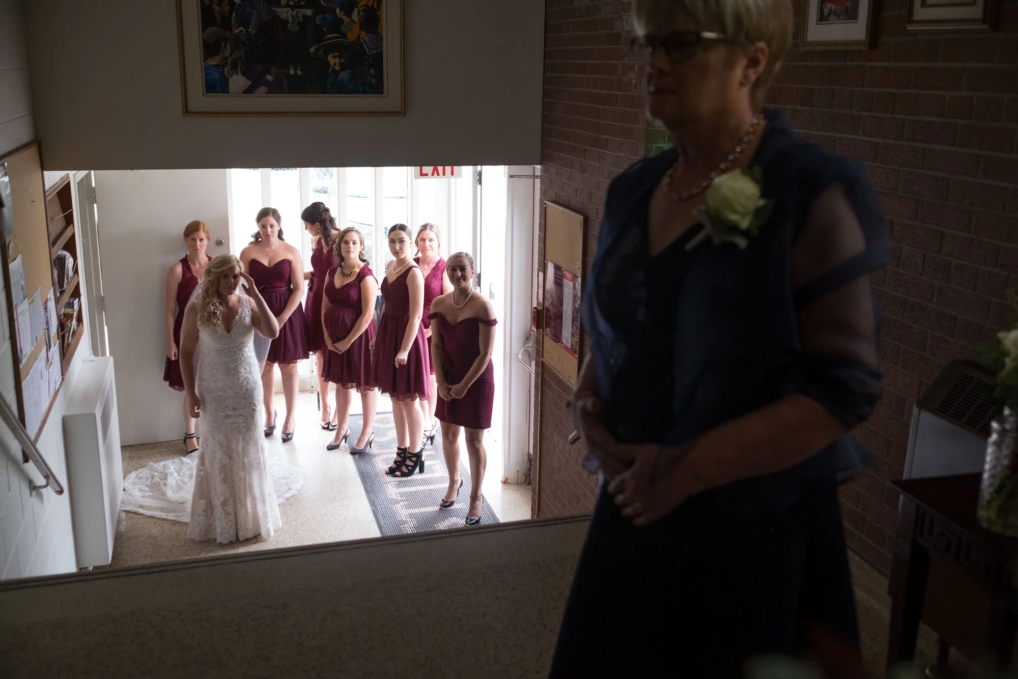 Sarah and her bridesmaids wait to enter the ceremony before her wedding at the Fermenting Cellar.