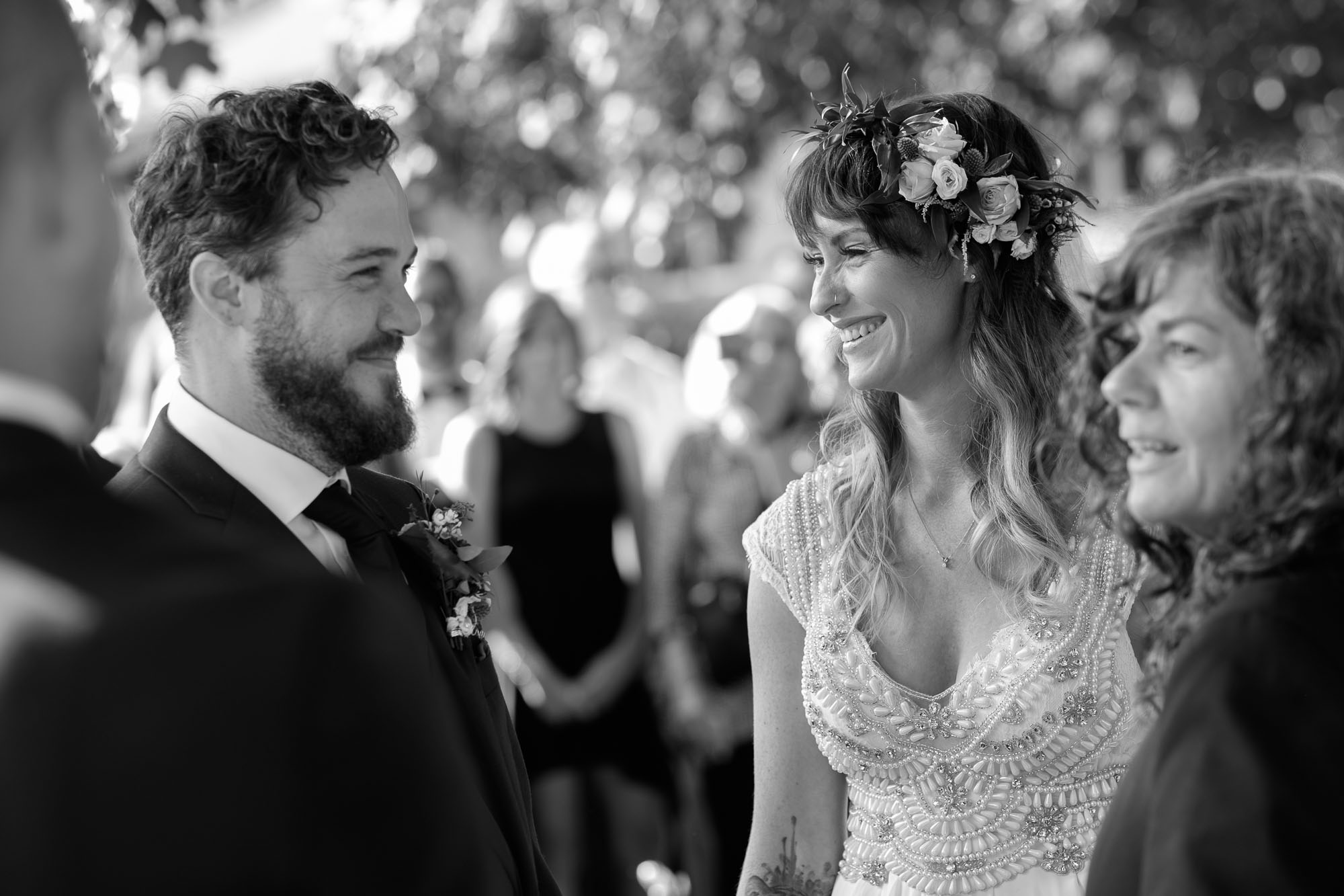 Kristin and Adam enjoy a moment during their wedding ceremony in their own backyard in Barrie, Ontario. By Scott Williams.