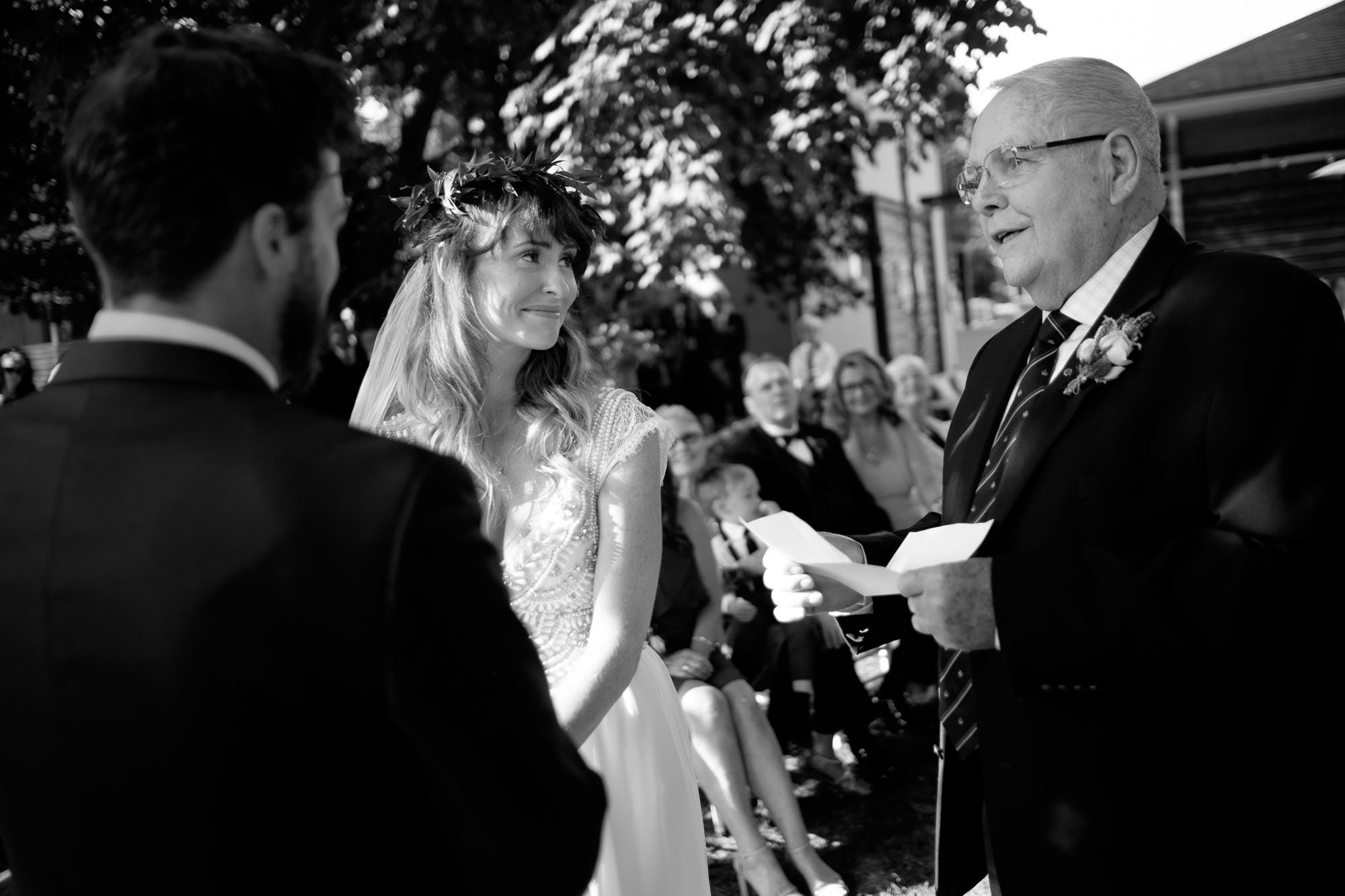 The bride's grandfather gives a traditional blessing during their wedding ceremony in their backyard in Barrie, Ontario. Photograph by Scott Williams.