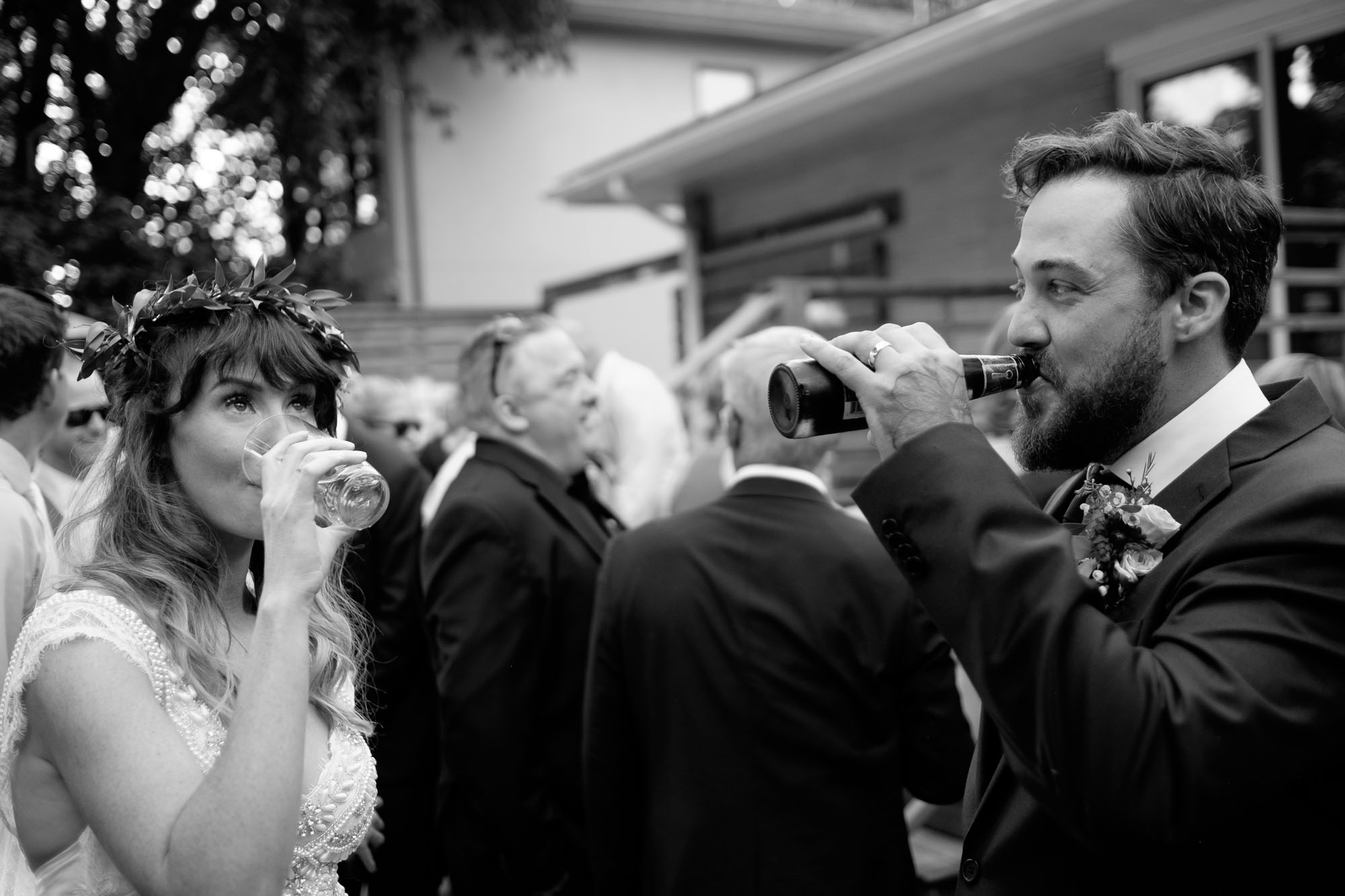  Kristin &amp; Adam share a drink right after their outdoor wedding ceremony during their backyard wedding in Barrie, Ontario. &nbsp;Photograph by Scott Williams. 