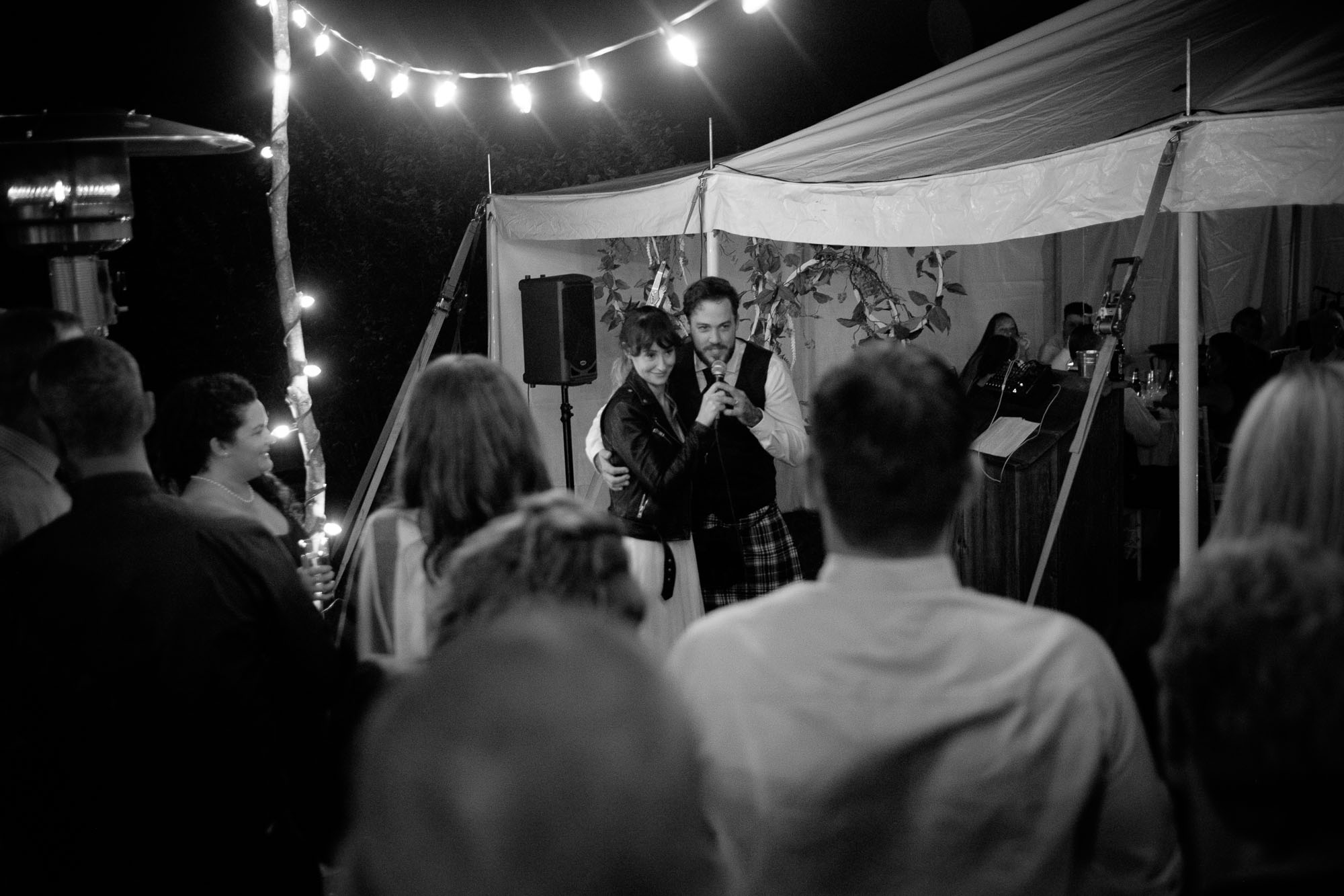 Kristin and Adam give an impromptu wedding speech to their friends and family during their wedding reception in Ontario. Photograph by Scott Williams.