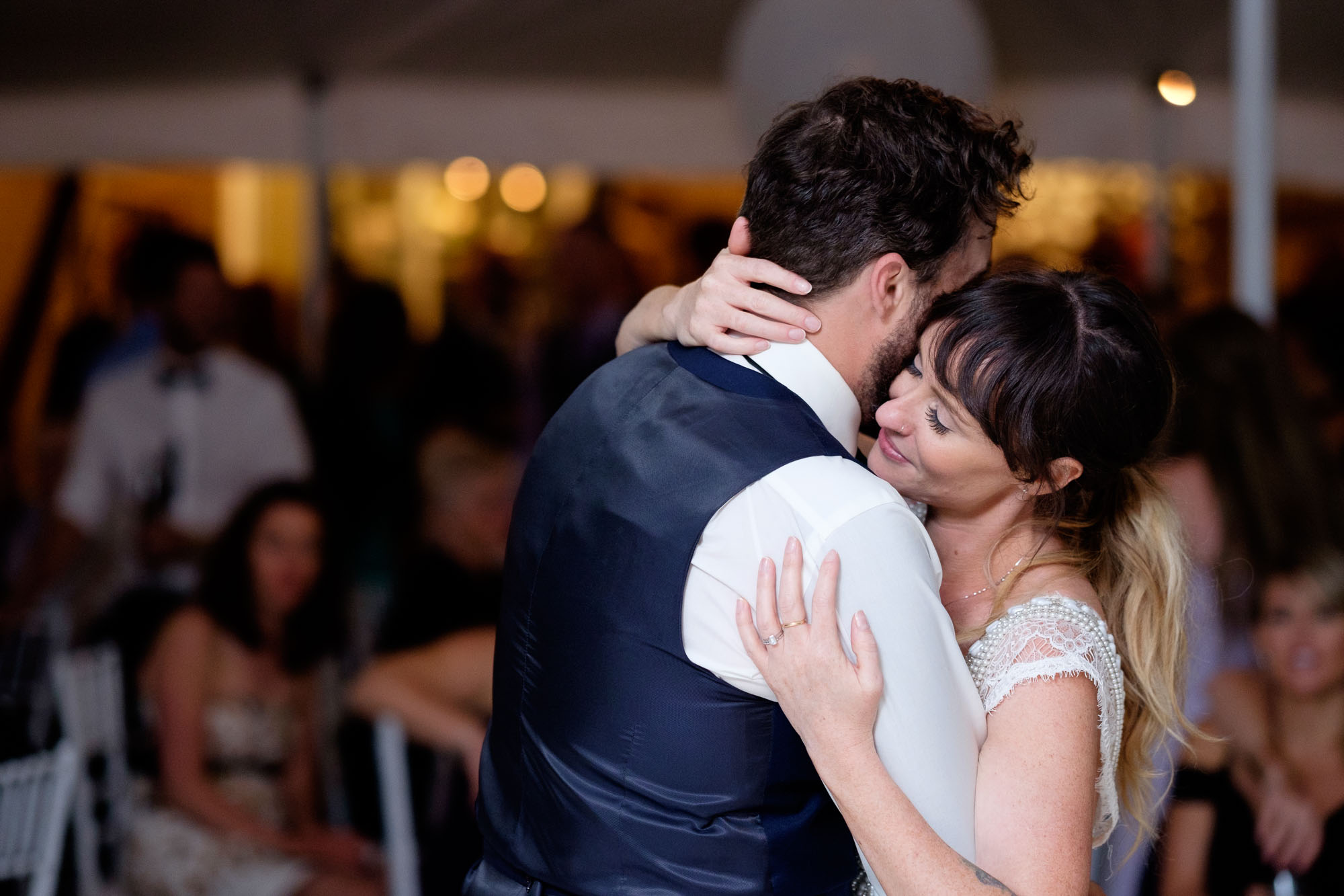 Kristin and Adam enjoy their fist dance as a newly married couple during their backyard wedding reception in Barrie, Ontario. Photograph by Scott Williams.