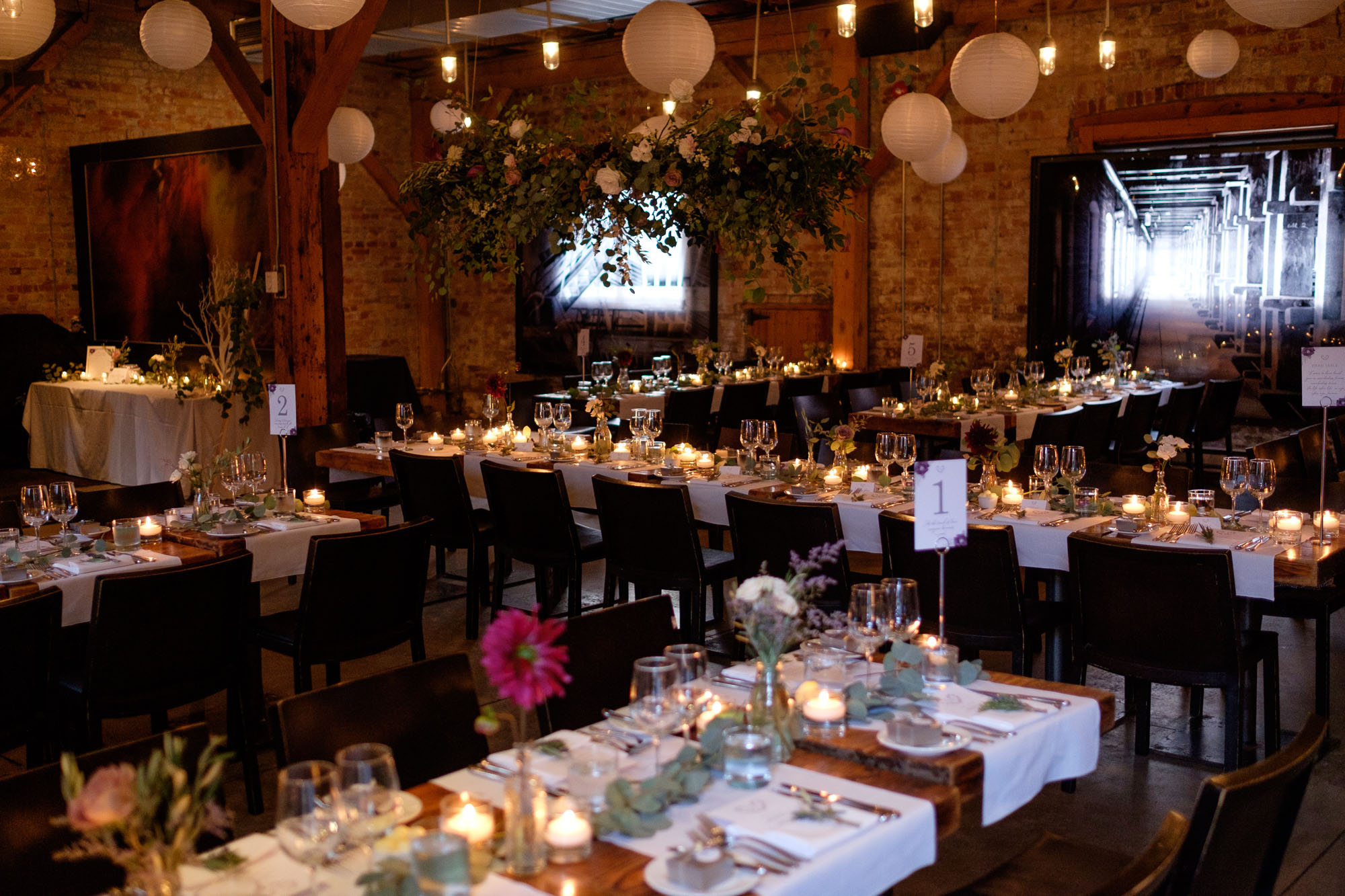 The wedding reception room set up at Archeo in the Distillery District for Cindy + Enrico's wedding.