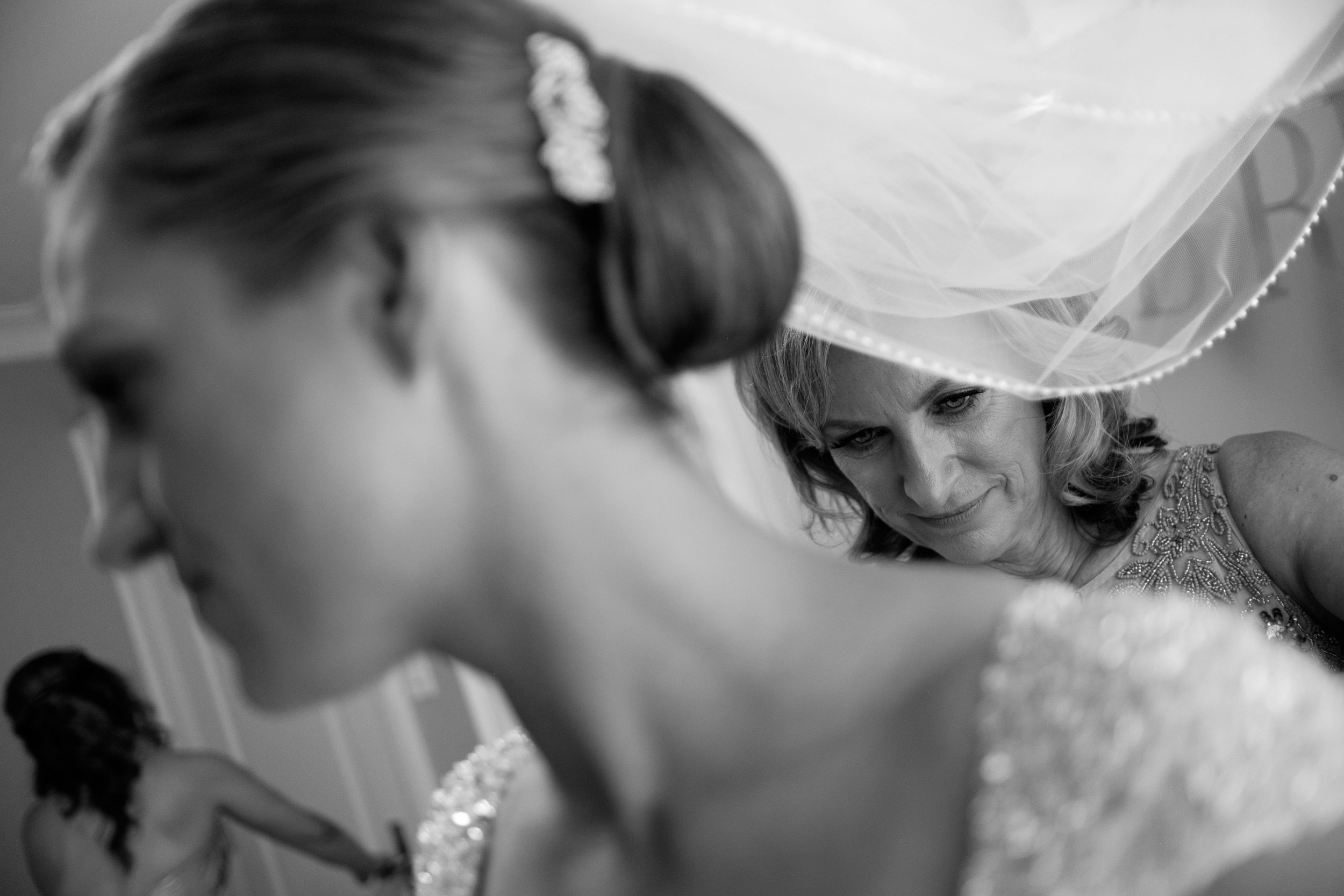 Sabrina's mom helps her get dressed before their wedding in Toronto.