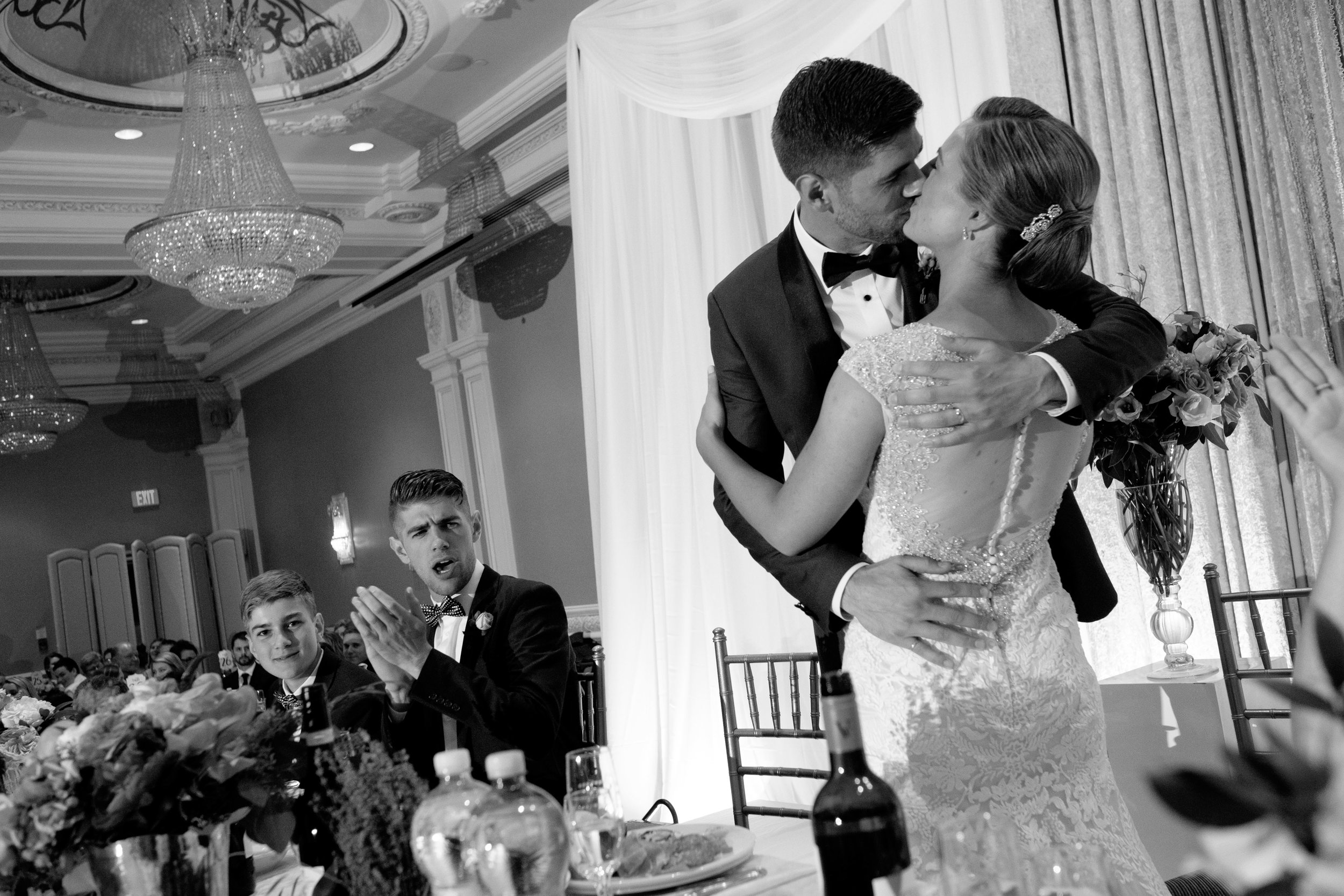  Sabrina and Zach share a kiss during their wedding reception at the Jewel Event Centre in Toronto.&nbsp; 