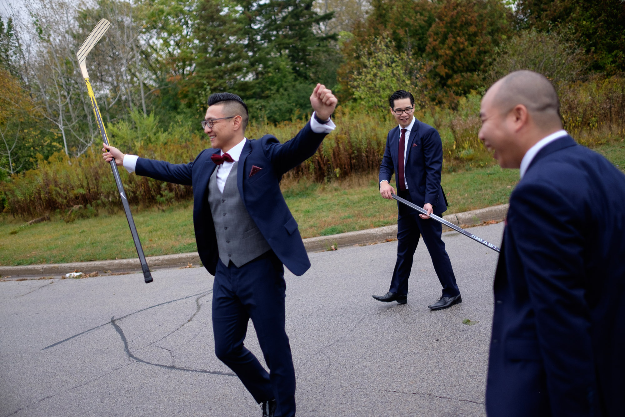  Chris plays road hockey with his groomsmen before his wedding at Madsens Greenhouse. 
