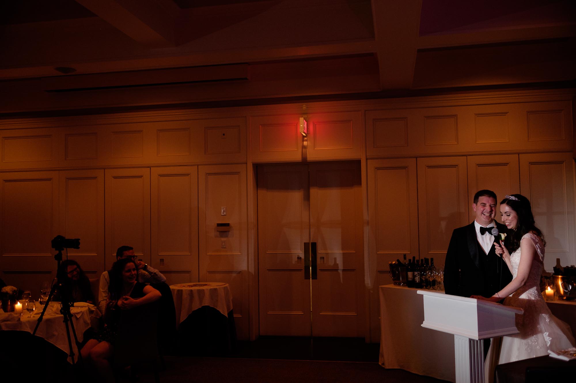 Rob and Amanda share a laugh during their speech at their wedding.