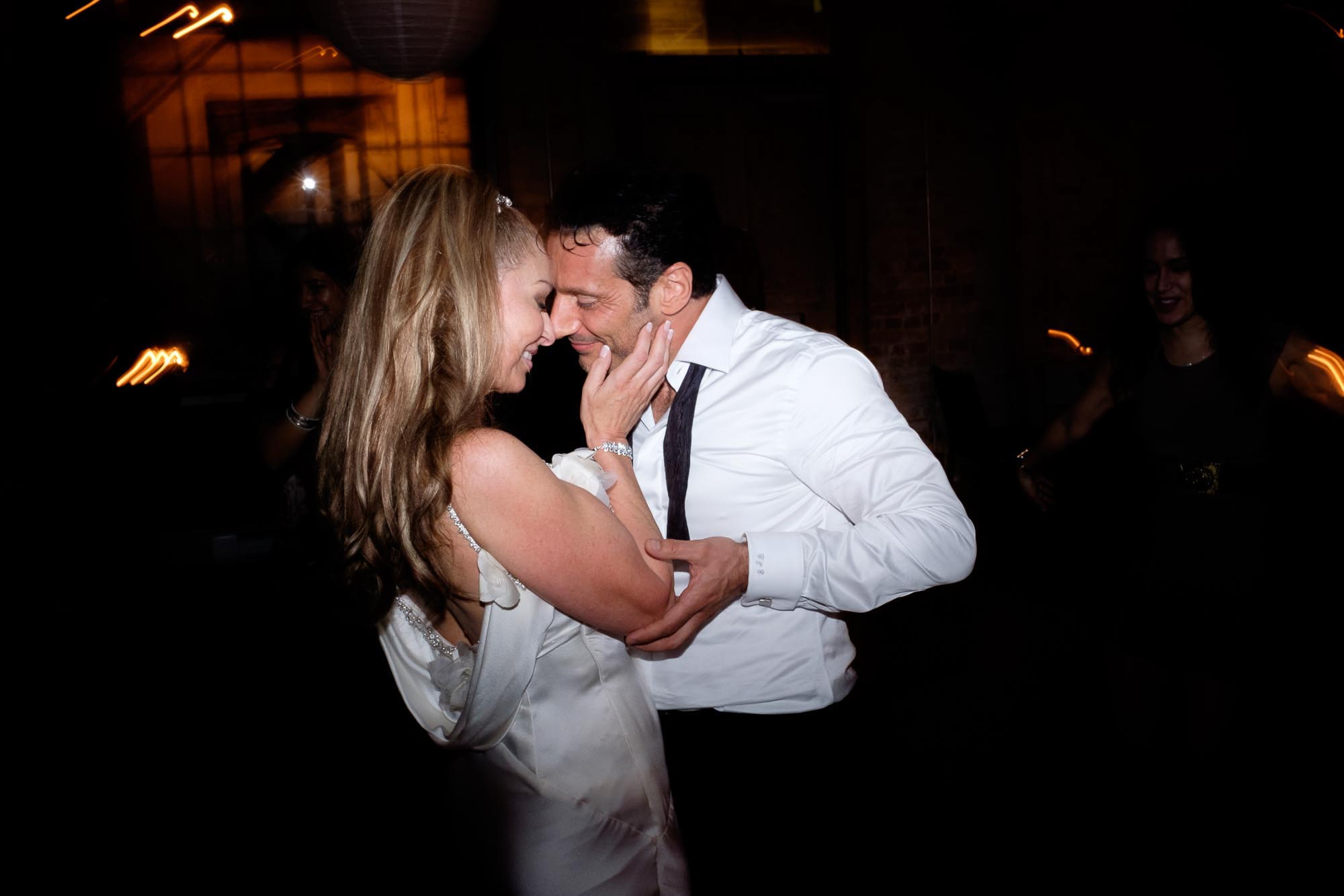  The bride and groom dance during the reception at their wedding at Archeo in Toronto's distillery district. 