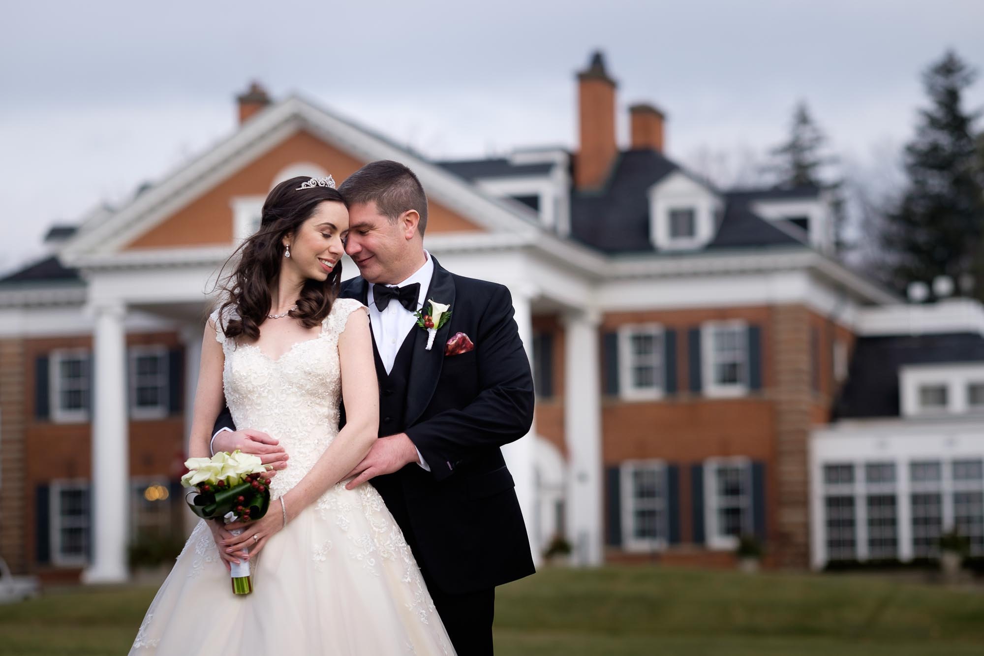  bride and groom pose for a wedding portrait outside of Langdon hall&nbsp; 