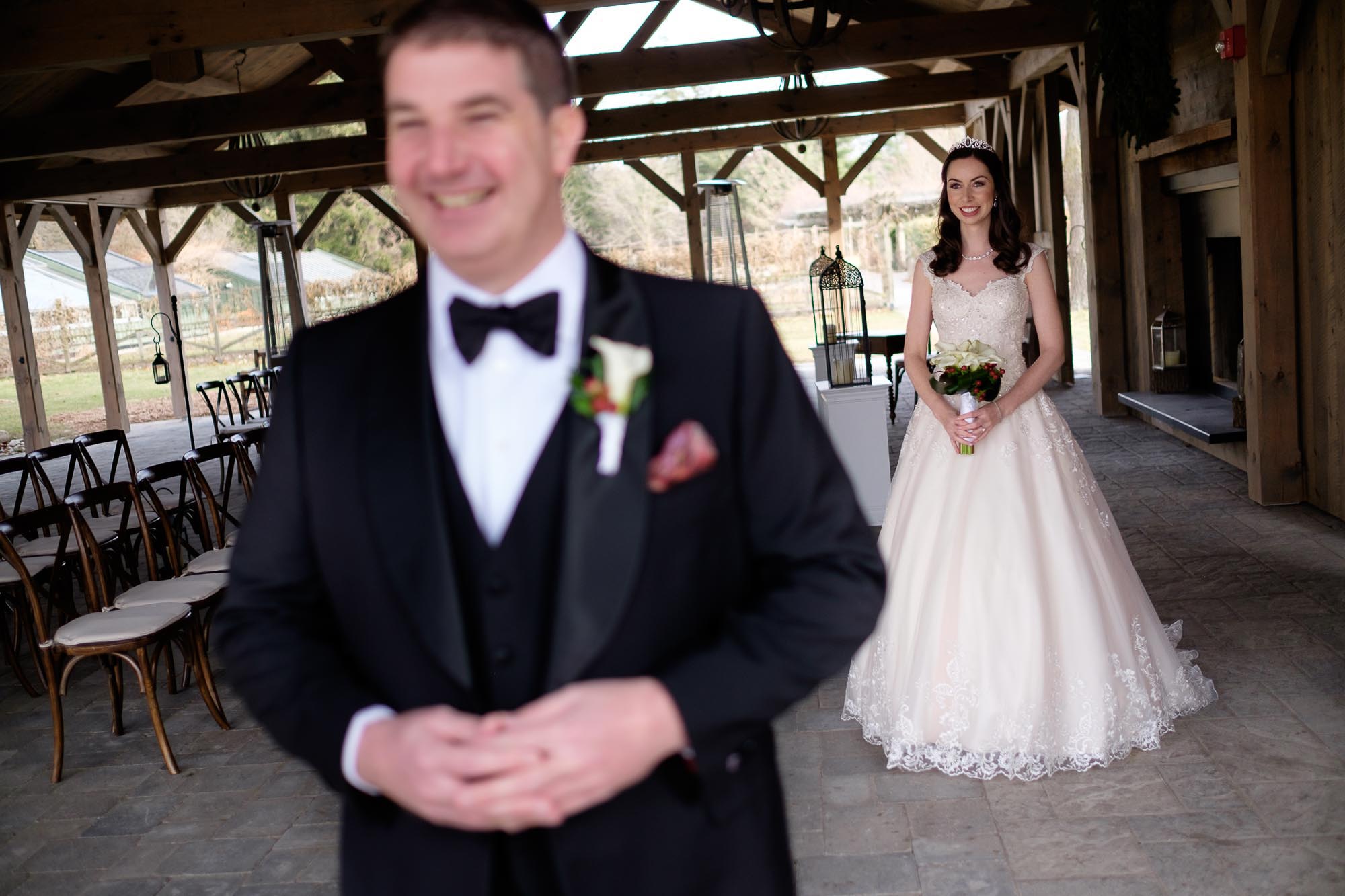  The bride and groom have their first look in Langdon Hall's Summer Room before their outdoor ceremony. 