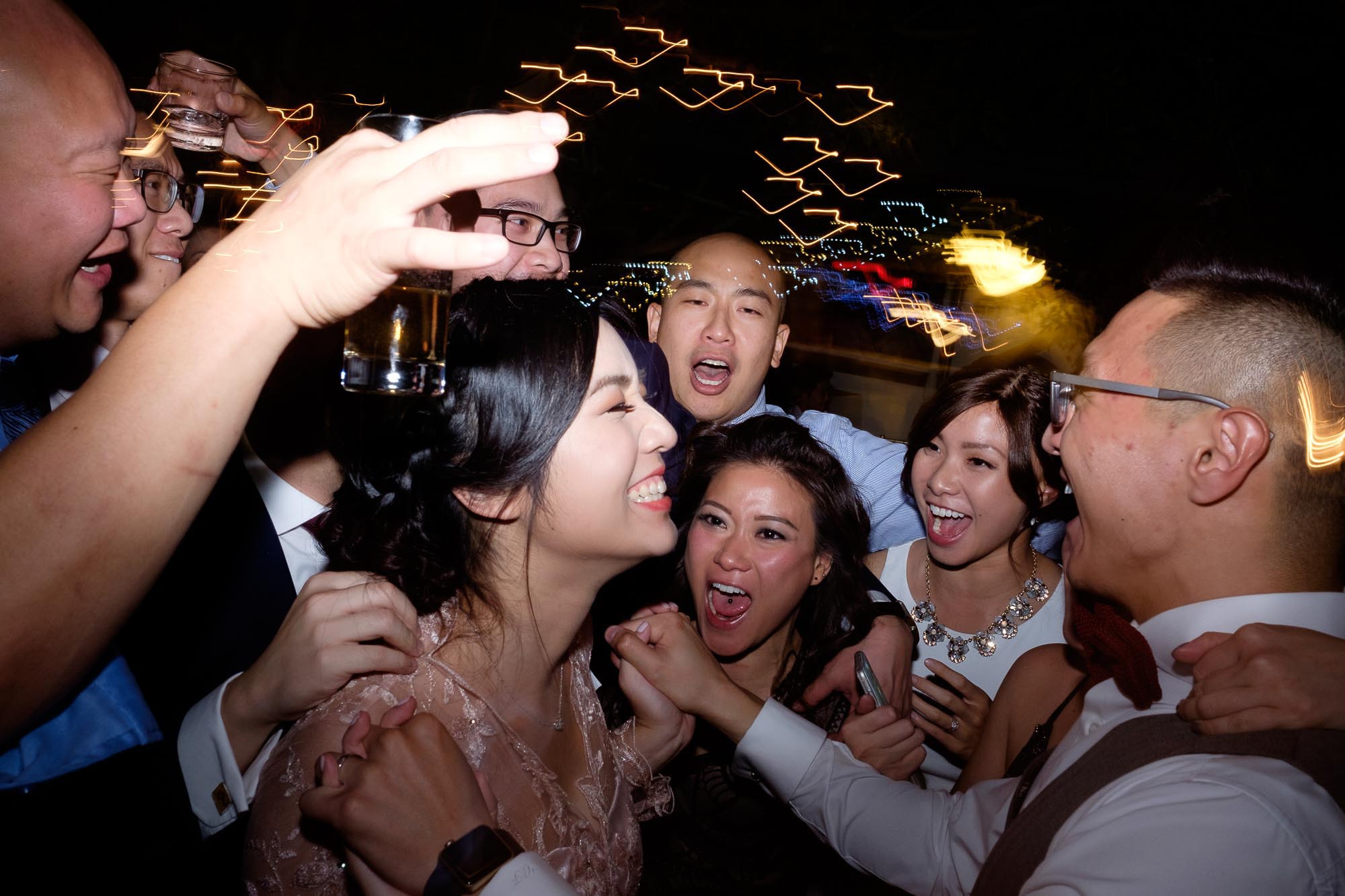  the bride and her closest friends party on the dance floor. 