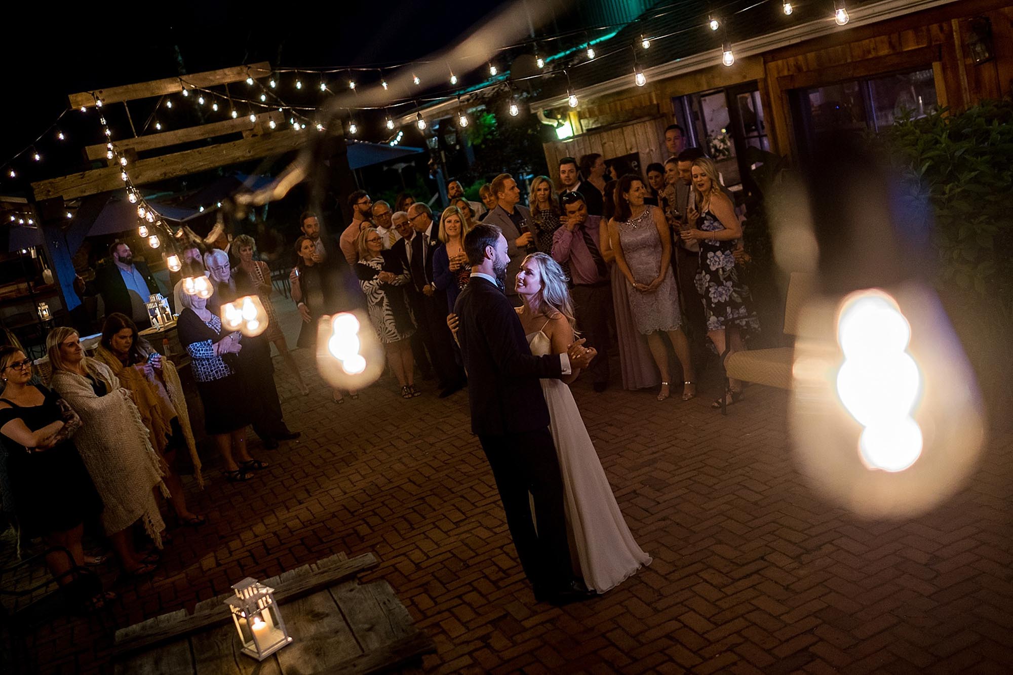  bride and groom enjoy their first dance outdoors as newlyweds during their reception at Hornburger Estate in Niagara on the Lake. 
