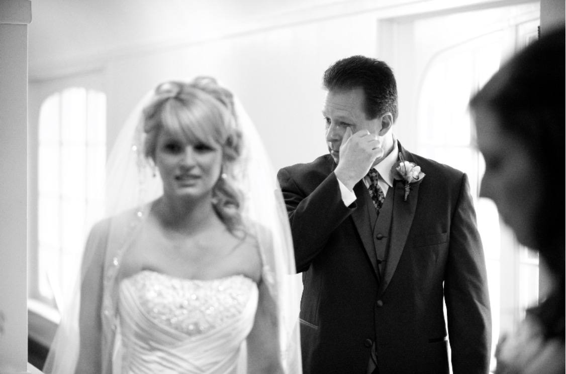 When I first look at this picture it brought tears to my eyes. I have always been “daddy’s little girl” and was surprised that my dad didn’t shed a tear on the day (or so I thought). Thanks to Scott a moment that I would have missed was captured. When I look back on it in 20 years it will still show the true emotion that my dad felt that day and that I truly was and still am “daddy’s little girl”. Melissa + Jason