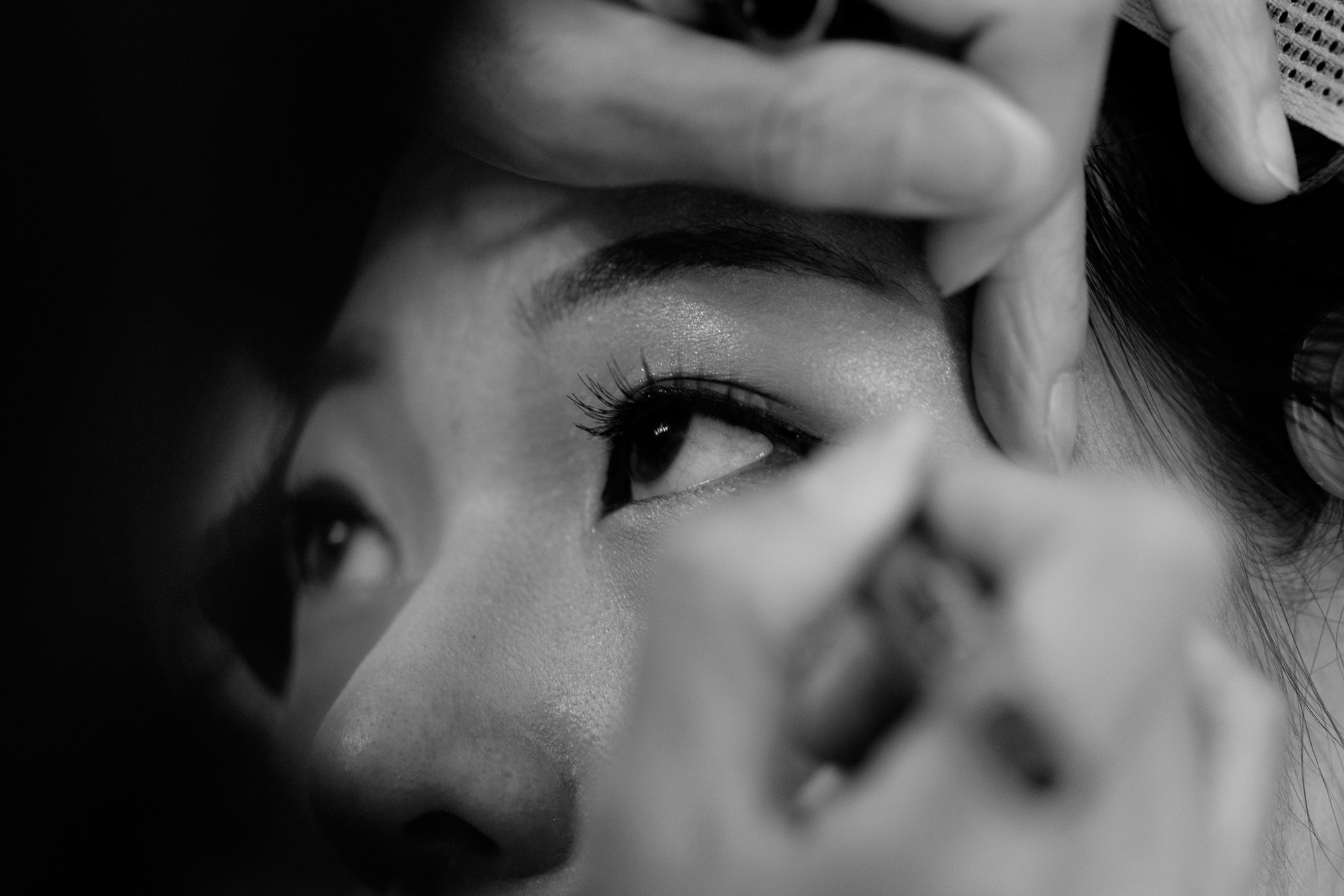 Makeup is applied as the bride and bridesmaids get ready before her Toronto wedding at Waterstone Estates.