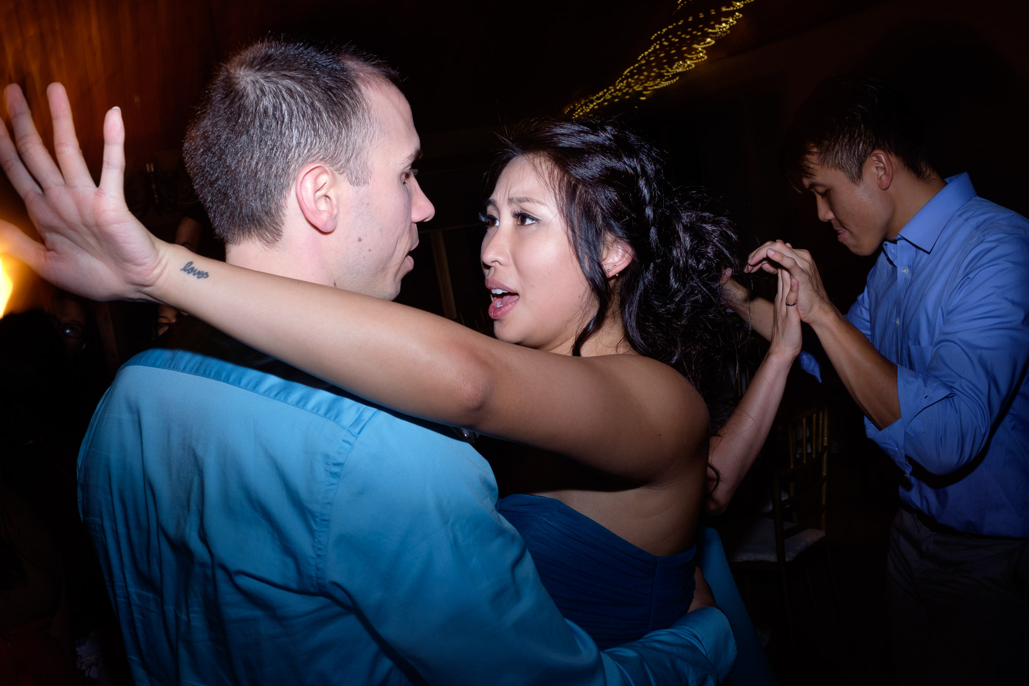  Wedding guests party it up on the dance floor during Chelsea + Danny’s wedding reception at Waterstone Estate. 