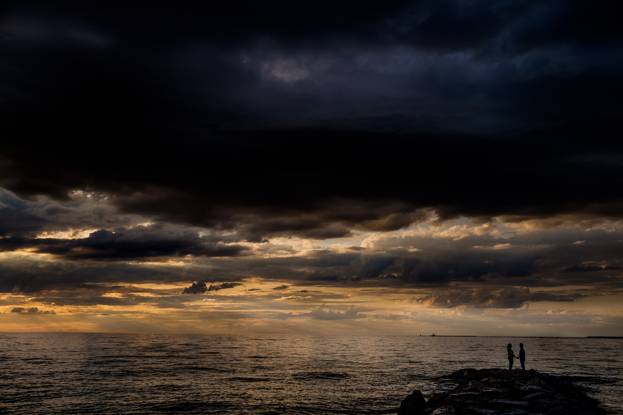  A wide angle golden hour sunset engagement portrait from Alex + Colton’s Goderich engagement session.  