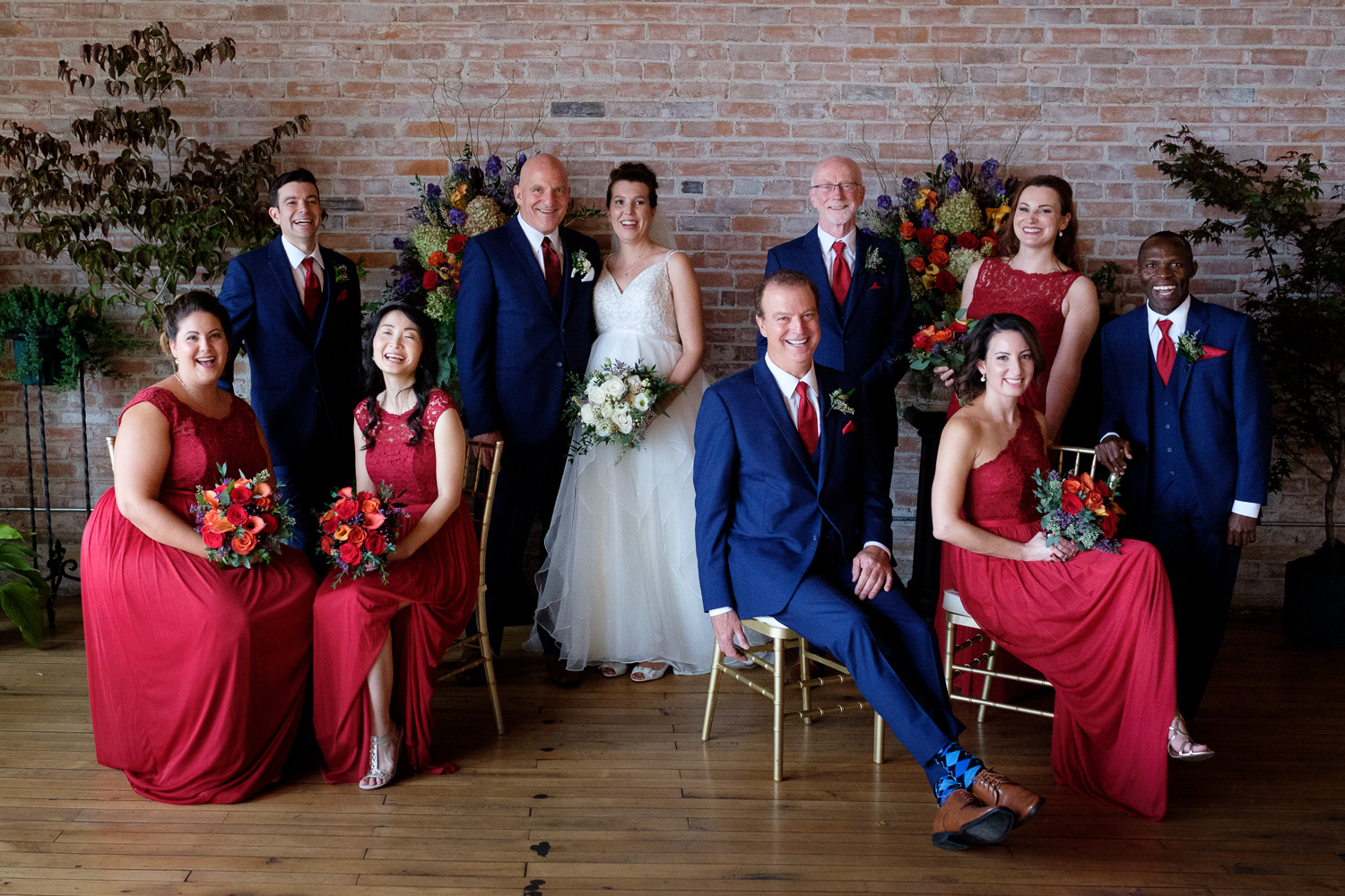  Stephen + Coral pose for a formal portrait with their wedding party at the Dominion Telegraph Event Centre in Paris, Ontario. 