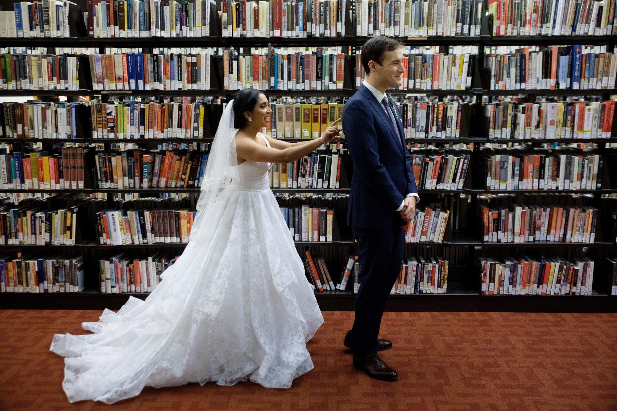  Rob and Andrea enjoy their first look before their new years eve wedding at the Toronto Reference Library. 