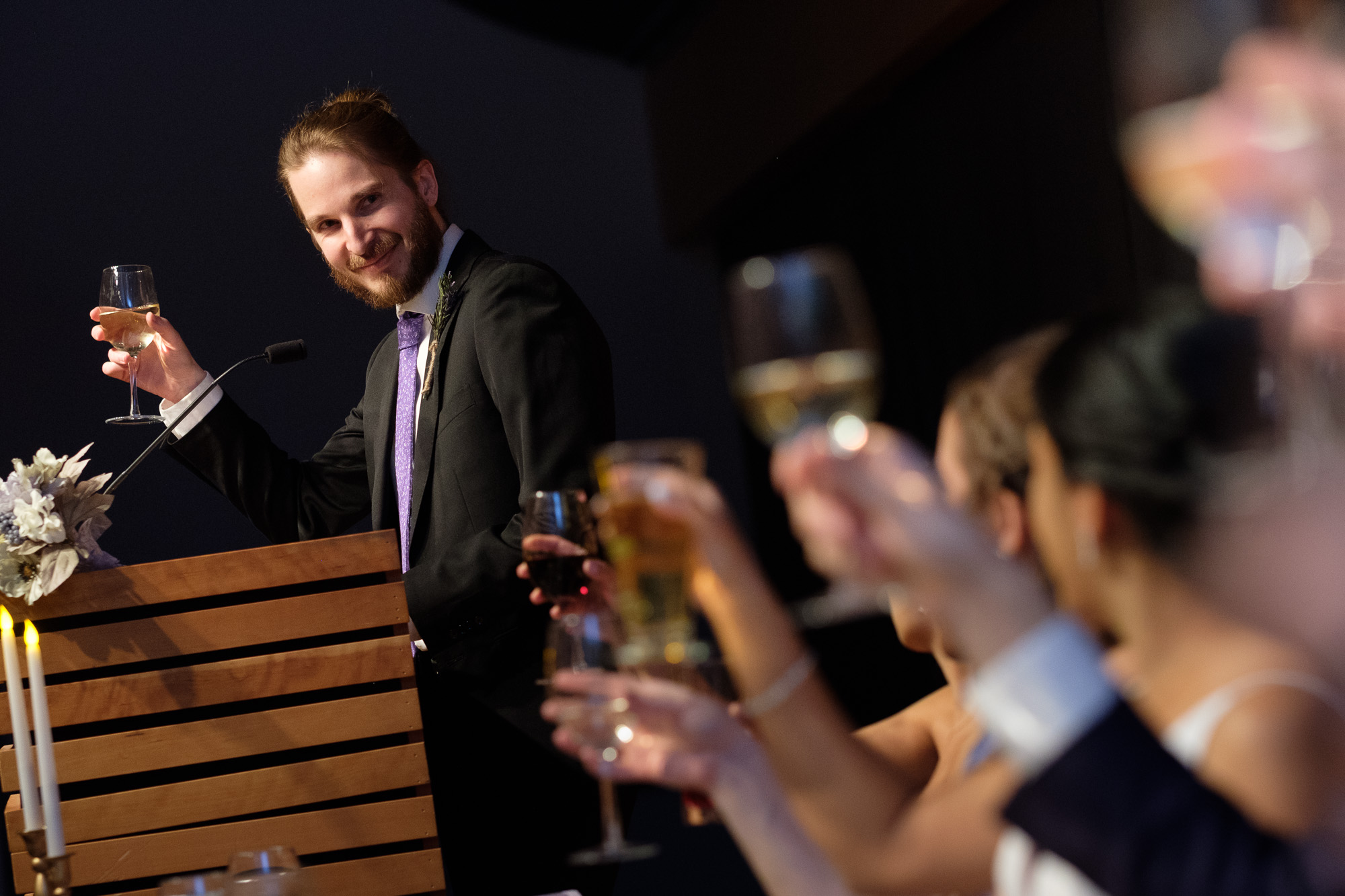 The best man gives a toast during the reception at Andrea + Rob’s New years eve wedding at the Toronto reference Library.