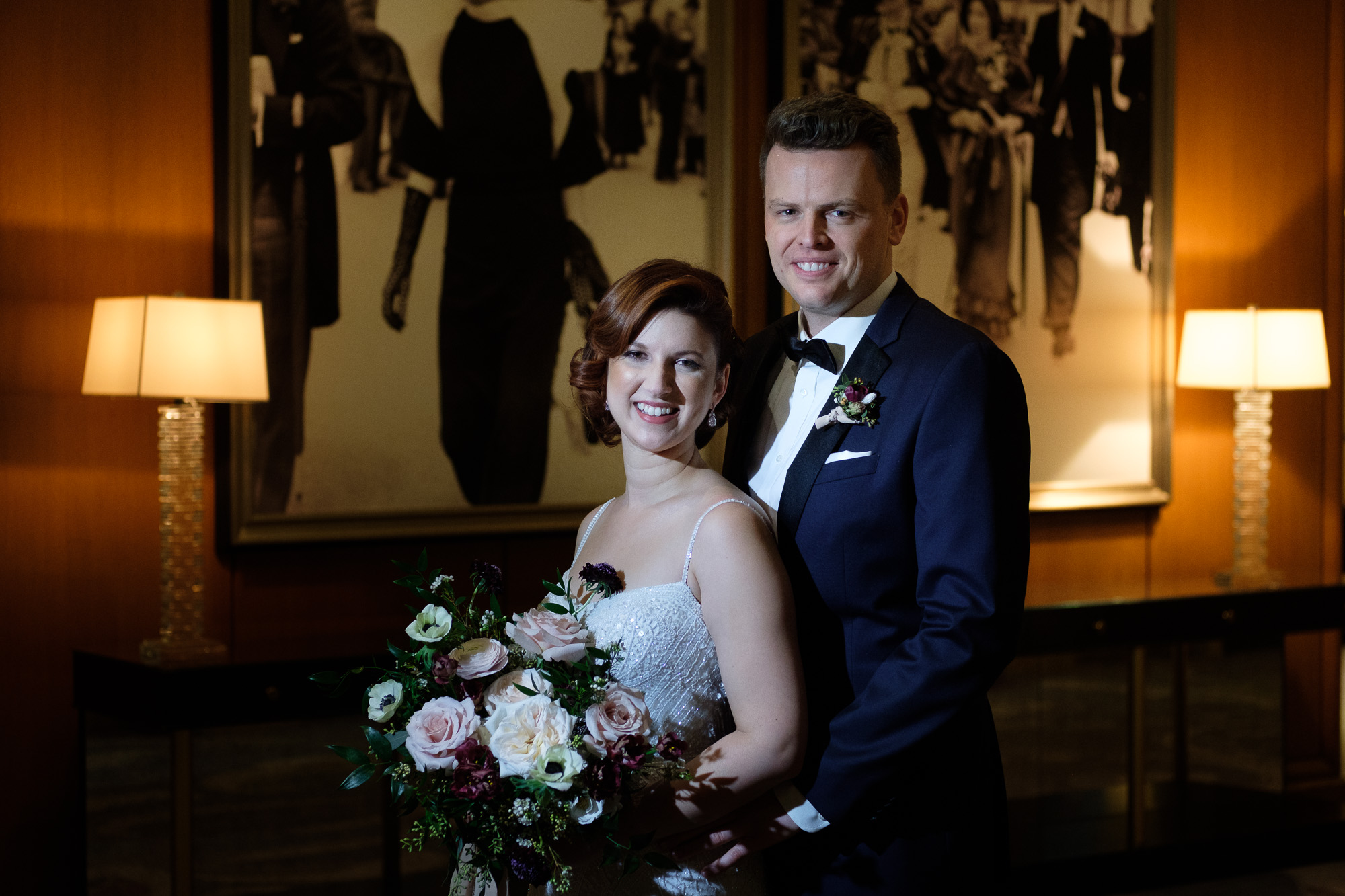  the bride and groom pose for a romantic portrait in the lobby of the King Edward Hotel in Toronto before their winter wedding at the Enoch Turner Schoolhouse. 