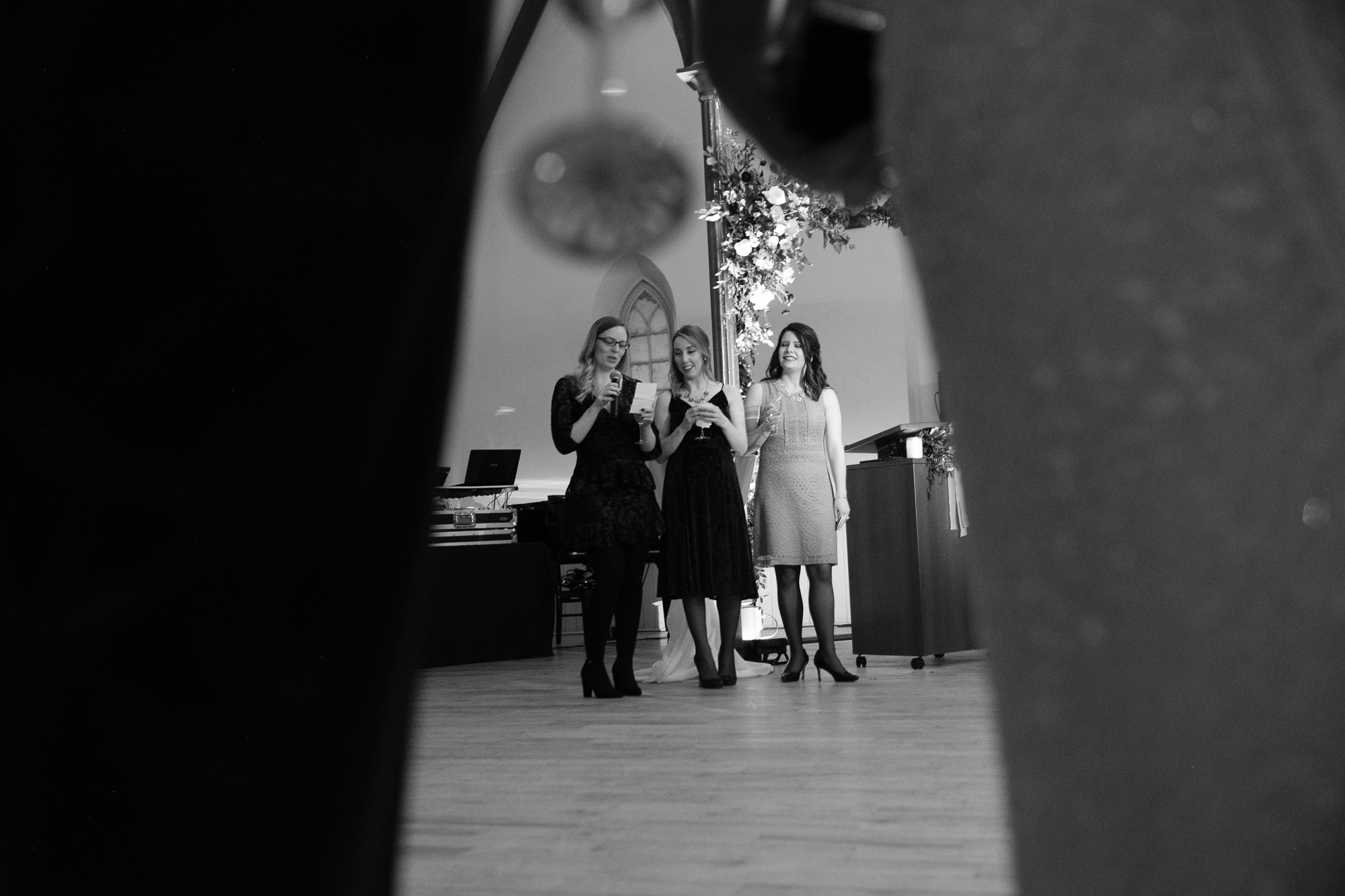 The brides best friends toast the couple during the winter wedding reception at the Enoch Turner Schoolhouse in Toronto.