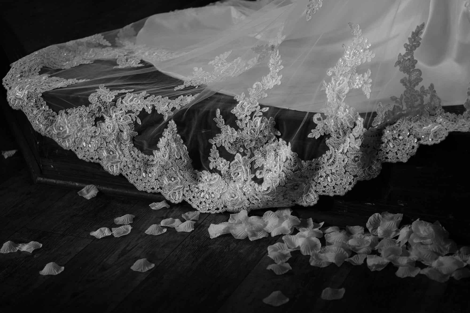  A black and white detail photograph of the brides dress during her wedding ceremony at the Glenerin Inn just outside of Toronto. 