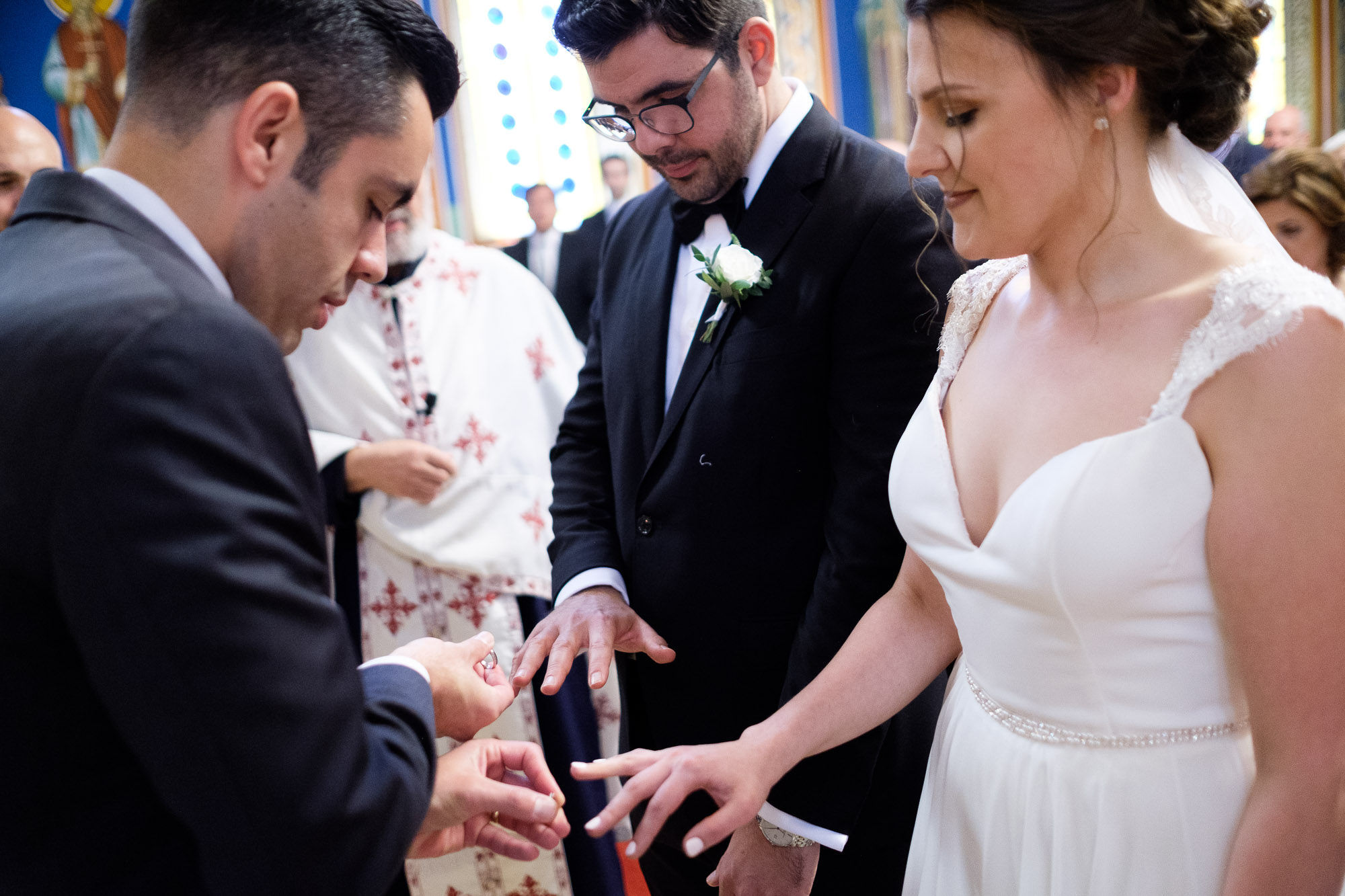  The best man exchanges the bride and grooms wedding rings during their Greek Orthodox wedding ceremony at St. Georges Greek Orthodox Church in Toronto. 