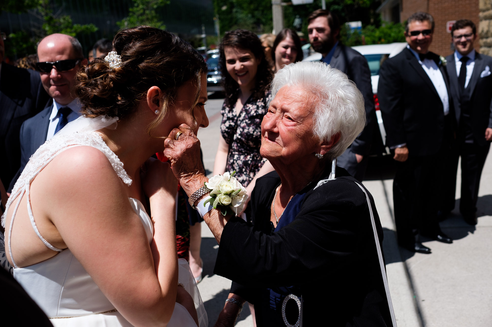  Katherine get’s her cheeks pinched by her grandmother after the wedding ceremony at St. George’s Greek Orthodox Church in Toronto. 