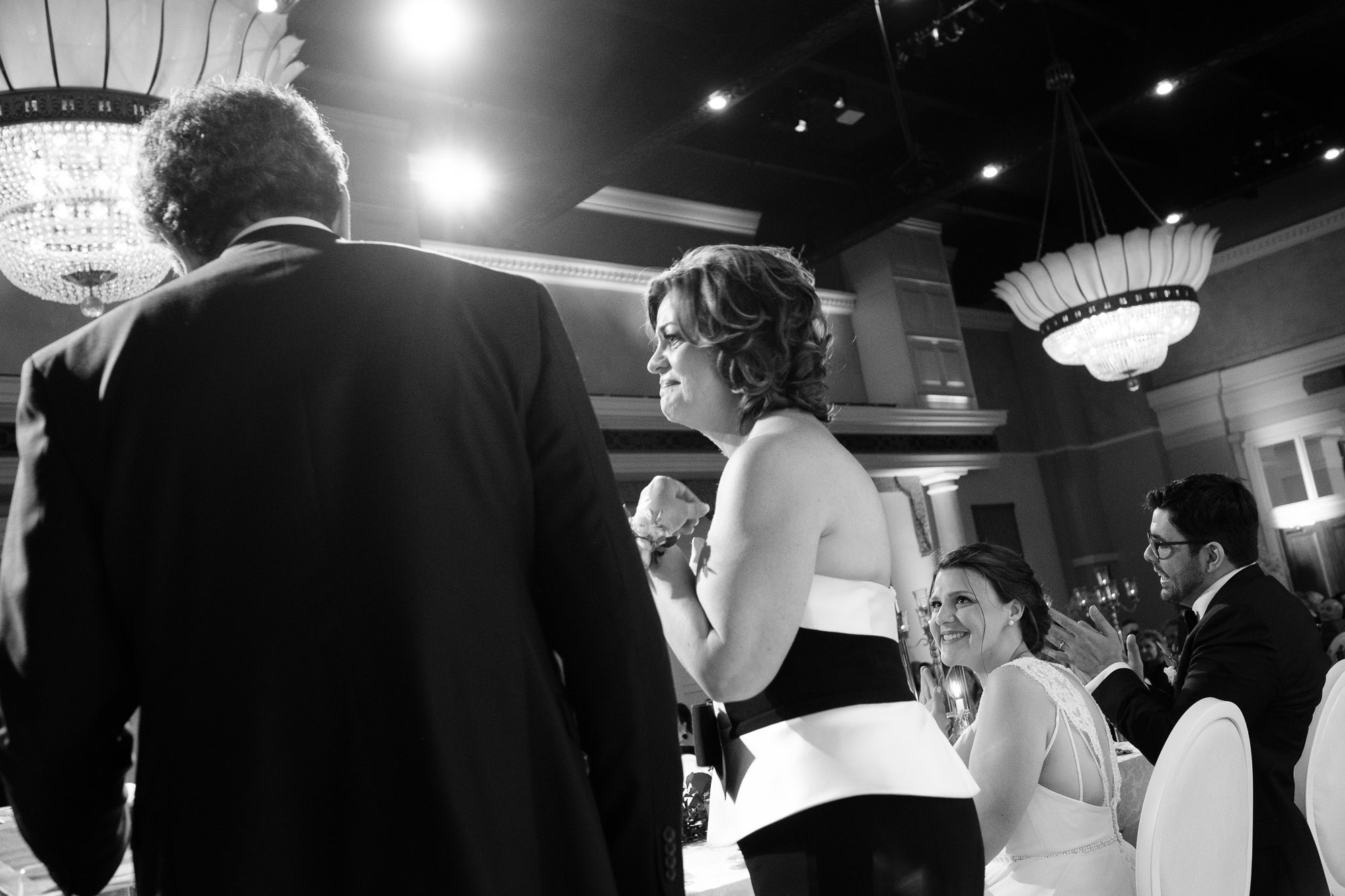 Katherine looks on as her parents give their wedding toast during the reception at Liberty Grand in Toronto.