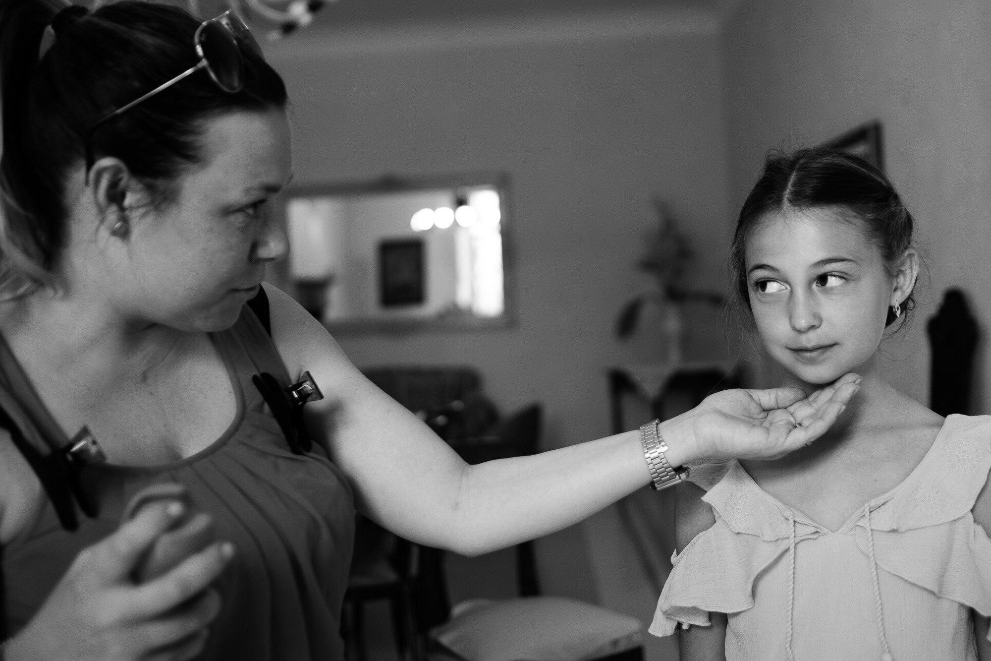  Elena’s daughter receives the finishing touches to her hair and makeup before Elena + Steve’s destination wedding in Tuscany, Italy by wedding photographer Scott Williams (www.scottwilliamsphotographer.com) 