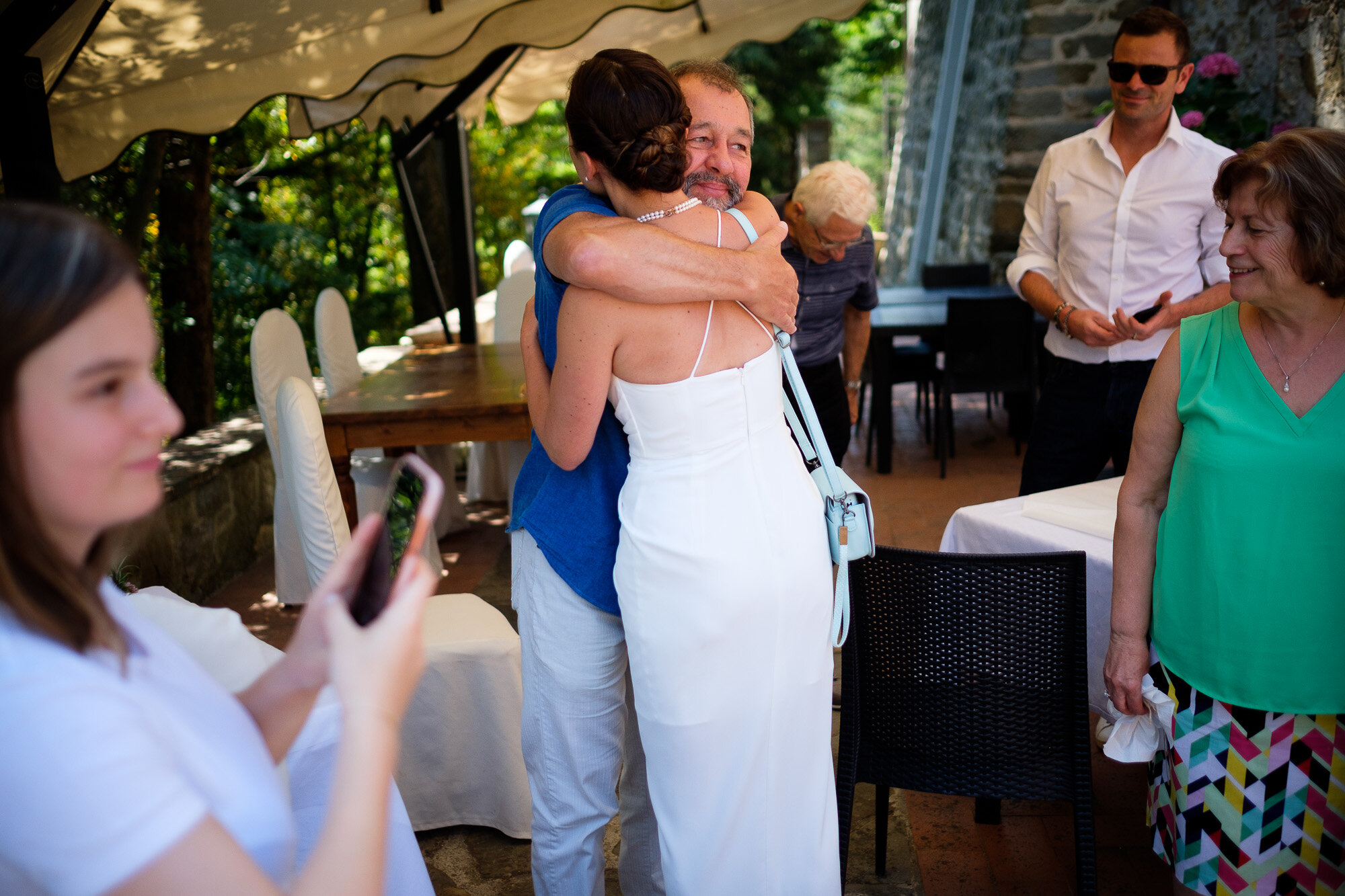  Elena receives a hug from her father before their civil ceremony during their Tuscany destination wedding by wedding photographer Scott Williams (www.scottwilliamsphotographer.com) 