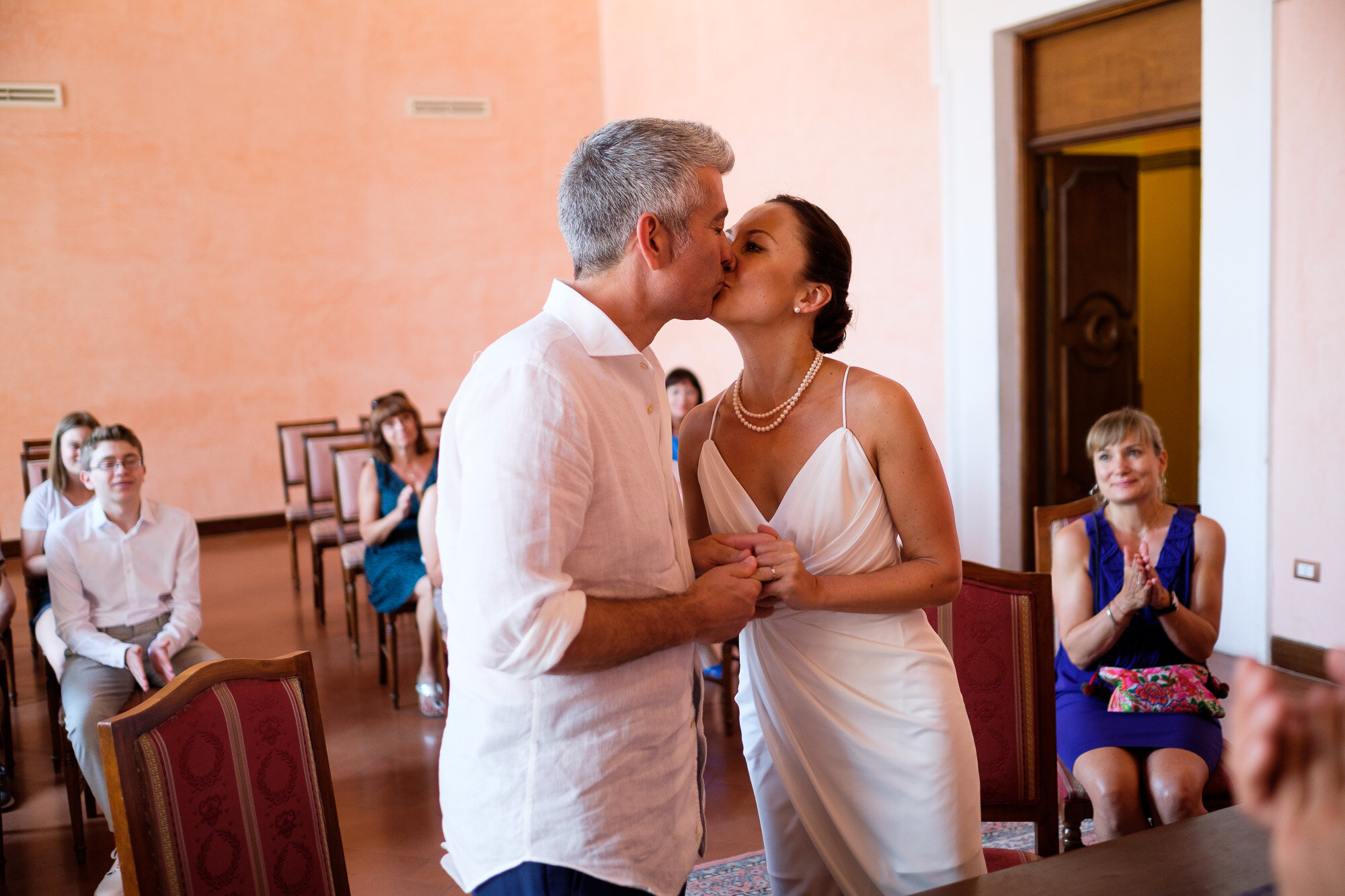  Elena + Steve share vows during their civil wedding ceremony at the local city hall during their destination wedding in Tuscany, Italy by wedding photographer Scott Williams (www.scottwilliamsphotographer.com) 