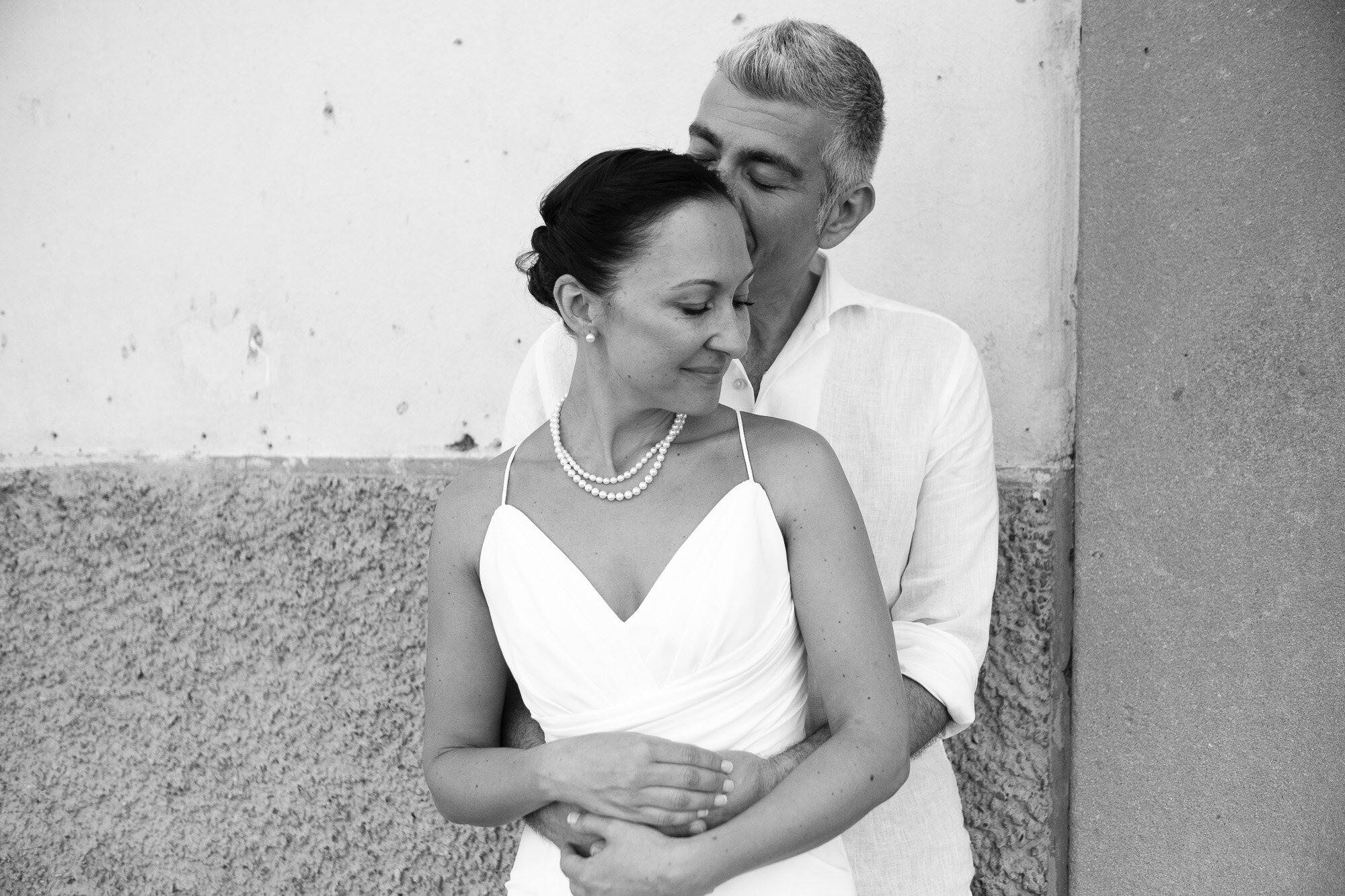  Elena and Steve pose for a relaxed portrait in the piazza in Pontassieve after the civil ceremony at Pontassieve’s city hall during their destination wedding in Tuscany, Italy by wedding photographer Scott Williams (www.scottwilliamsphotographer.com