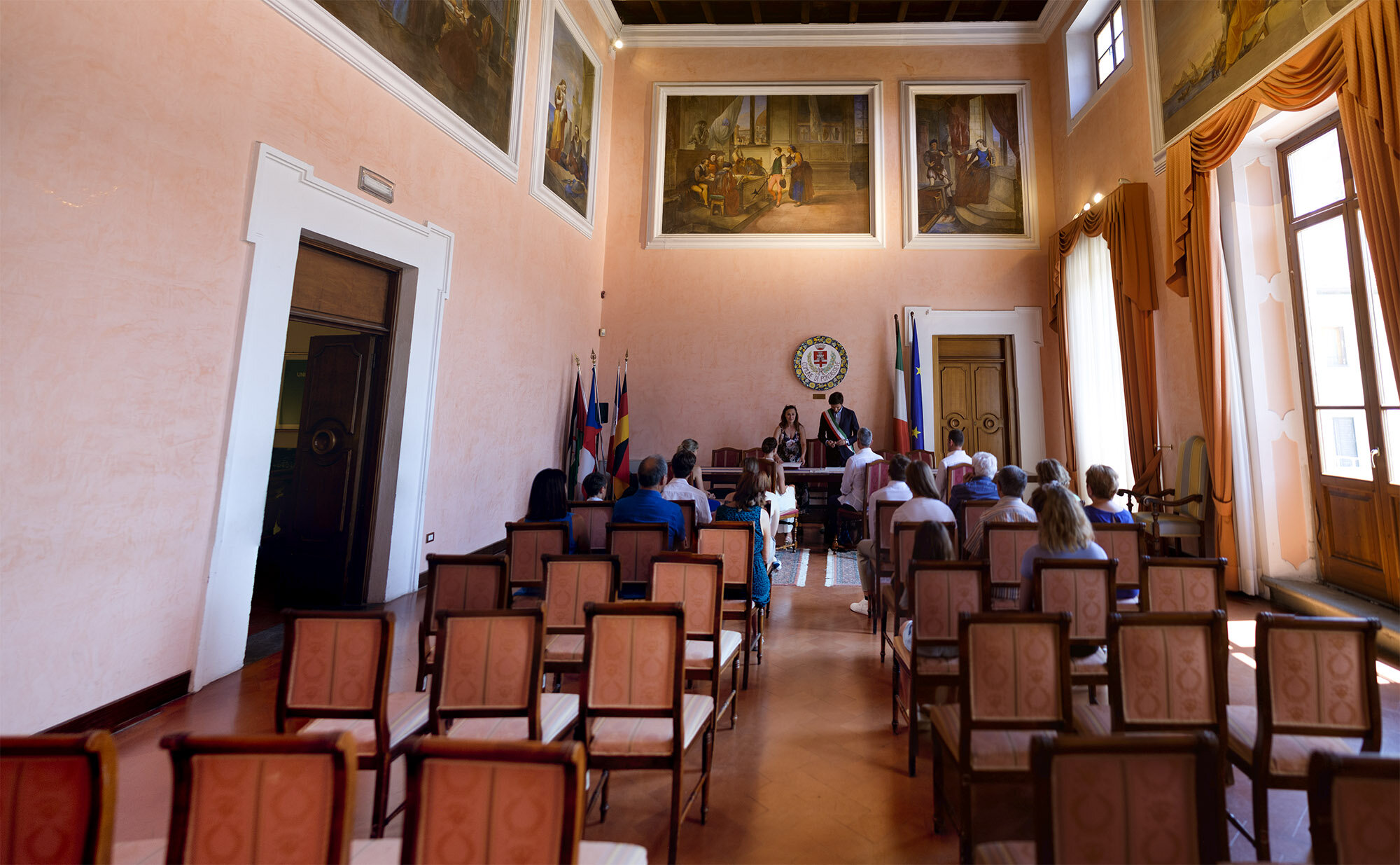  Elena and Steve listen to the local city official officiate their civil ceremony during their Tuscany destination wedding by wedding photographer Scott Williams (www.scottwilliamsphotographer.com) 