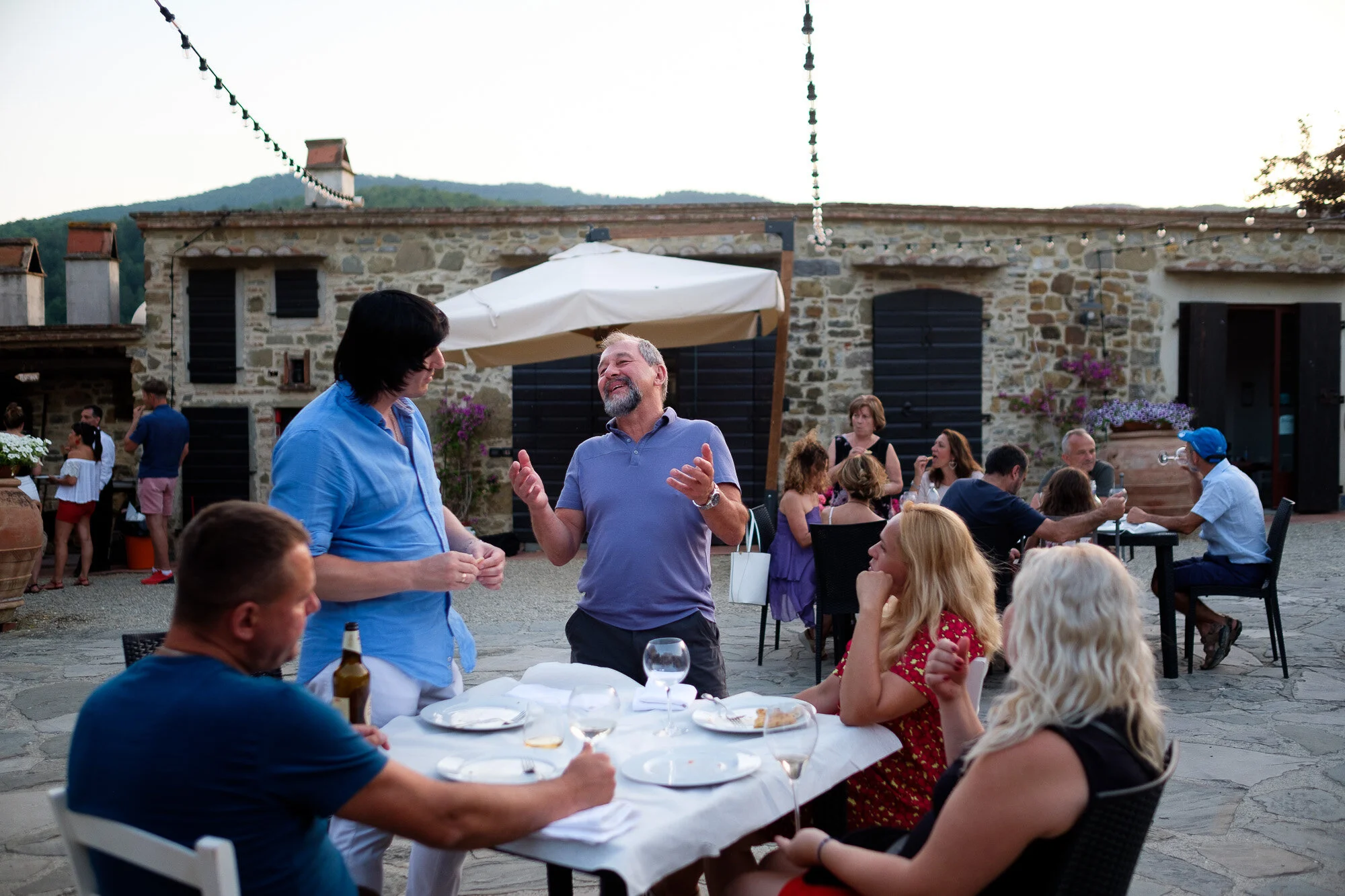 A wedding photograph from a party reception the day after Elena + Steve’s destination wedding at the villa La Sorgente di Francesca in Tuscany, Italy by wedding photographer Scott Williams (www.scottwilliamsphotographer.com)