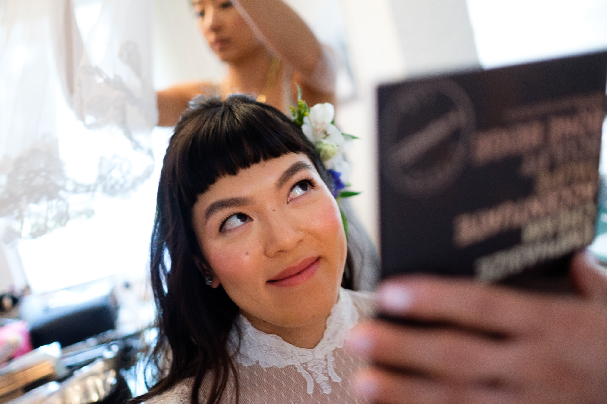  Huong has her makeup applied while getting ready at the grooms family home in North York before the wedding ceremony at St Gabriel’s Parish in Toronto. 