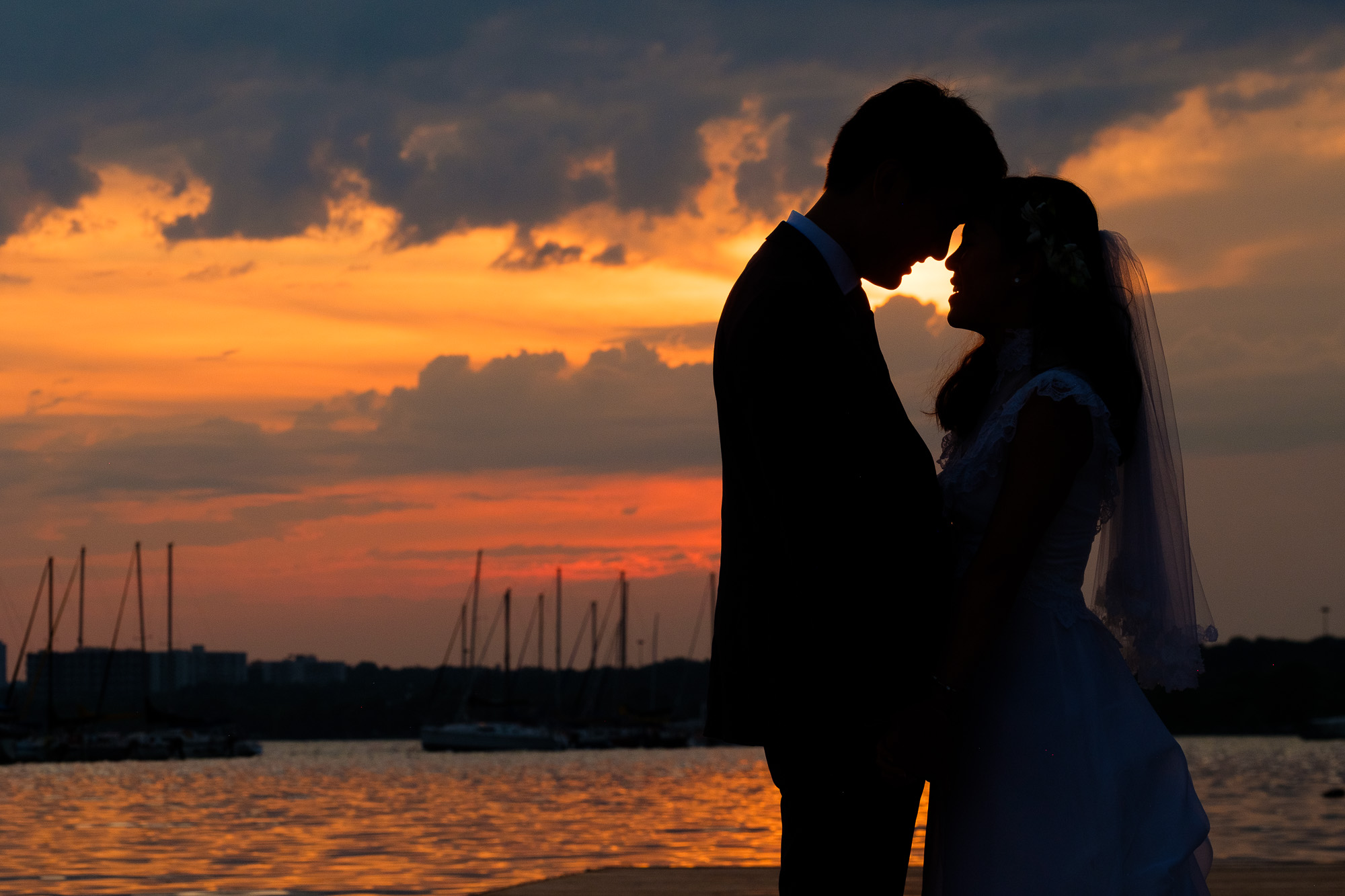  Huong + Aaron pose for some sunset portraits on the docks of the Argonaut Rowing Club on Toronto’s waterfront during their wedding reception. 