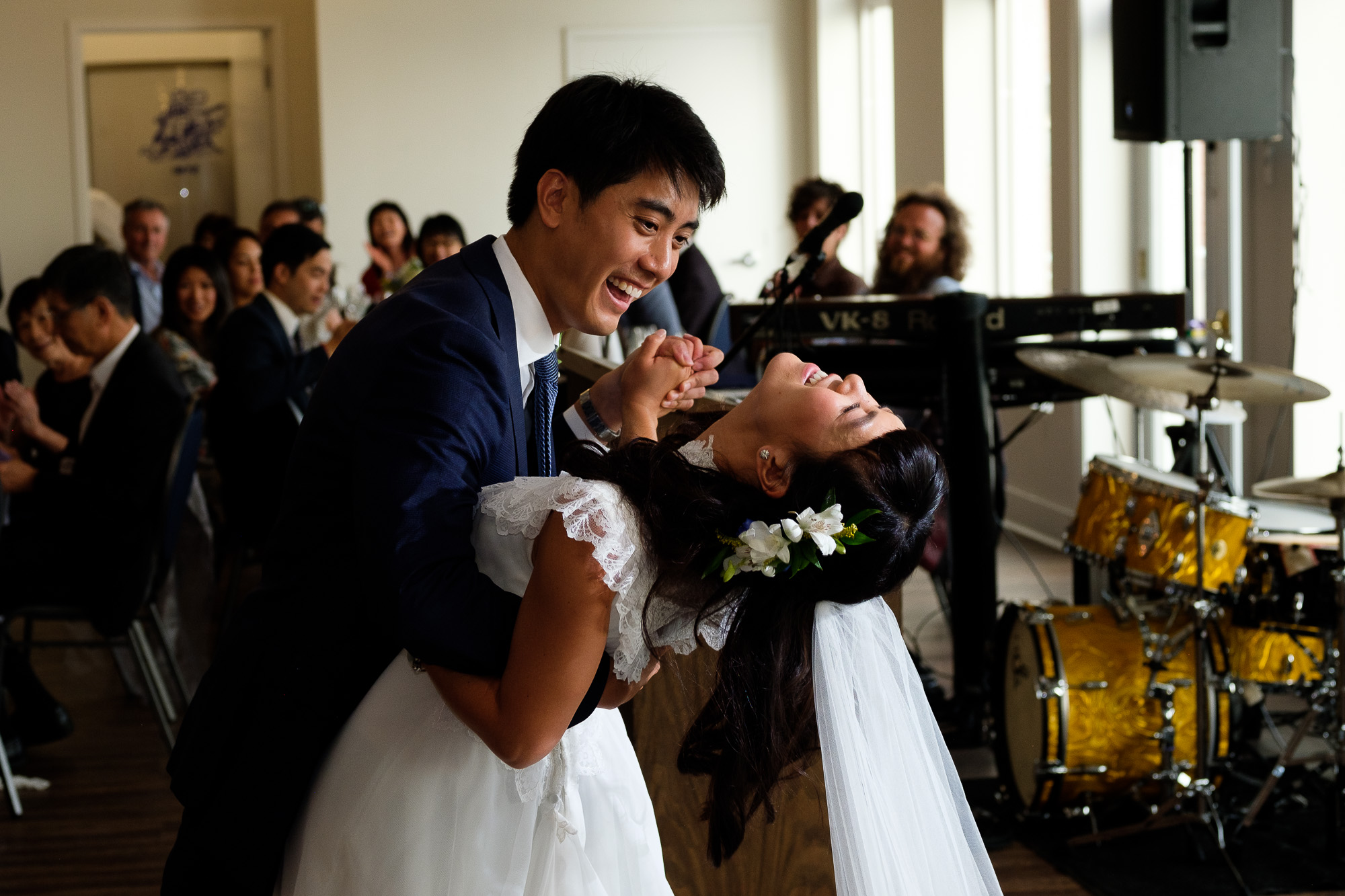 Huong + Aaron enjoy their first dance at their wedding reception at the Toronto Argonaut Rowing Club.