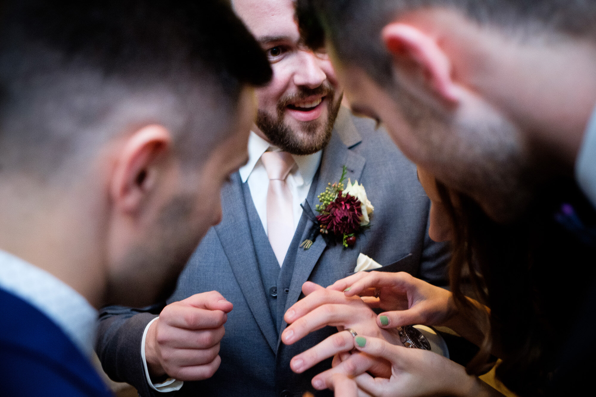  The groom shows off his new wedding ring during the reception at the Three Bridges event centre located outside of Waterloo, Ontario. Photograph by Toronto wedding photographer Scott Williams. 