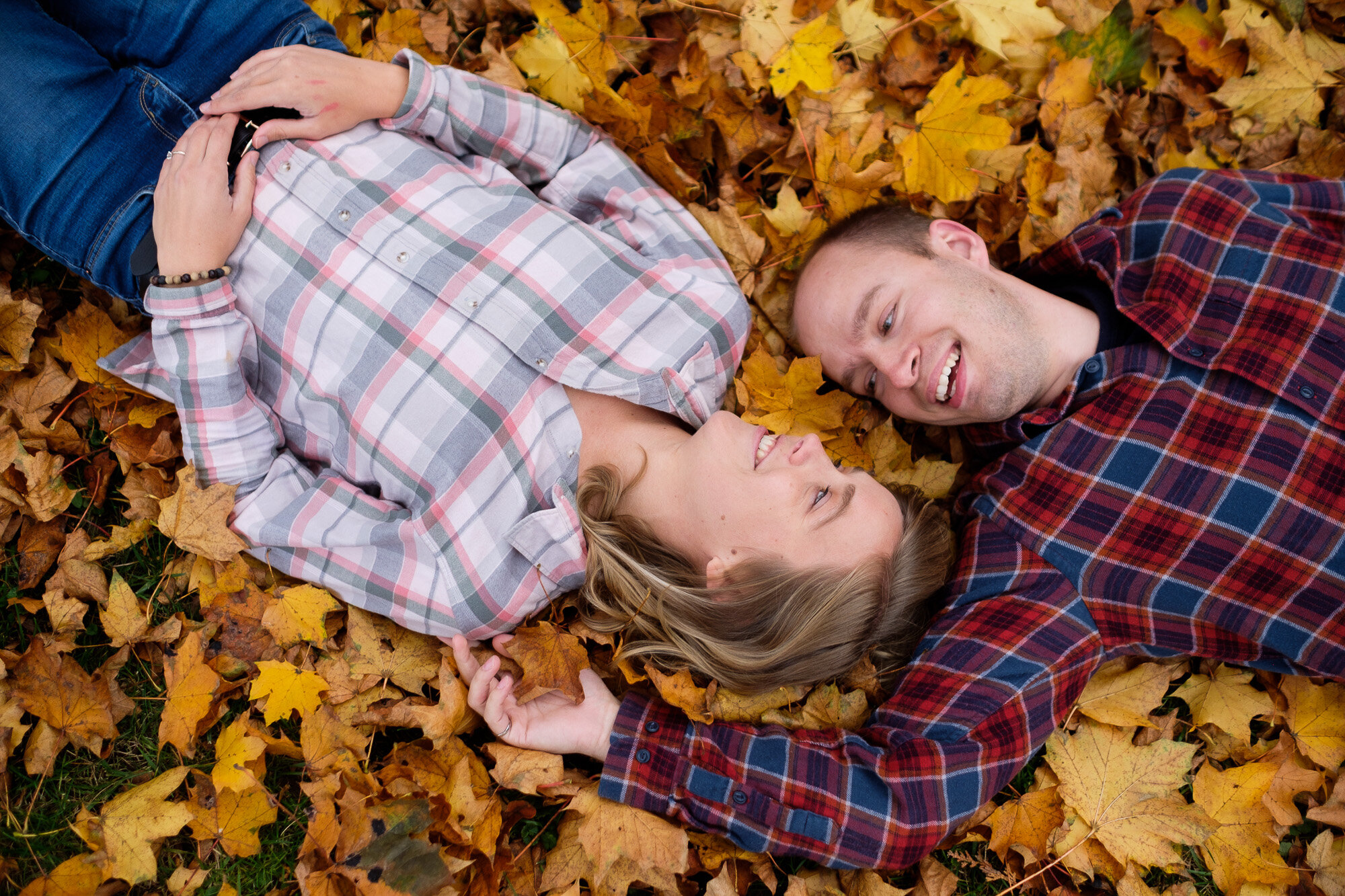  Lisa + Tyler pose for engagement pictures with beautiful fall colours at Lowville Park in Burlington, Ontario by Toronto wedding photographer Scott Williams. 