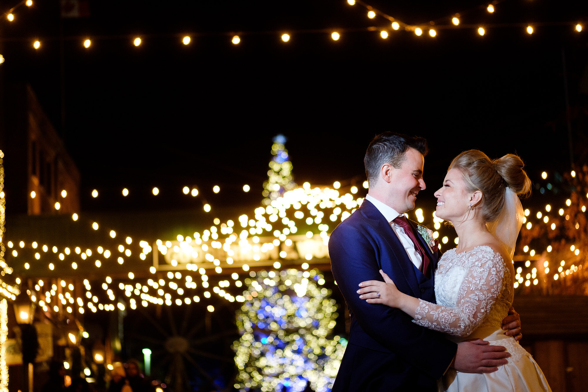  Emily and Aaron pose for a nighttime wedding portrait in the distillery district during  their wedding at Archeo by Toronto Wedding Photographer Scott Williams. 