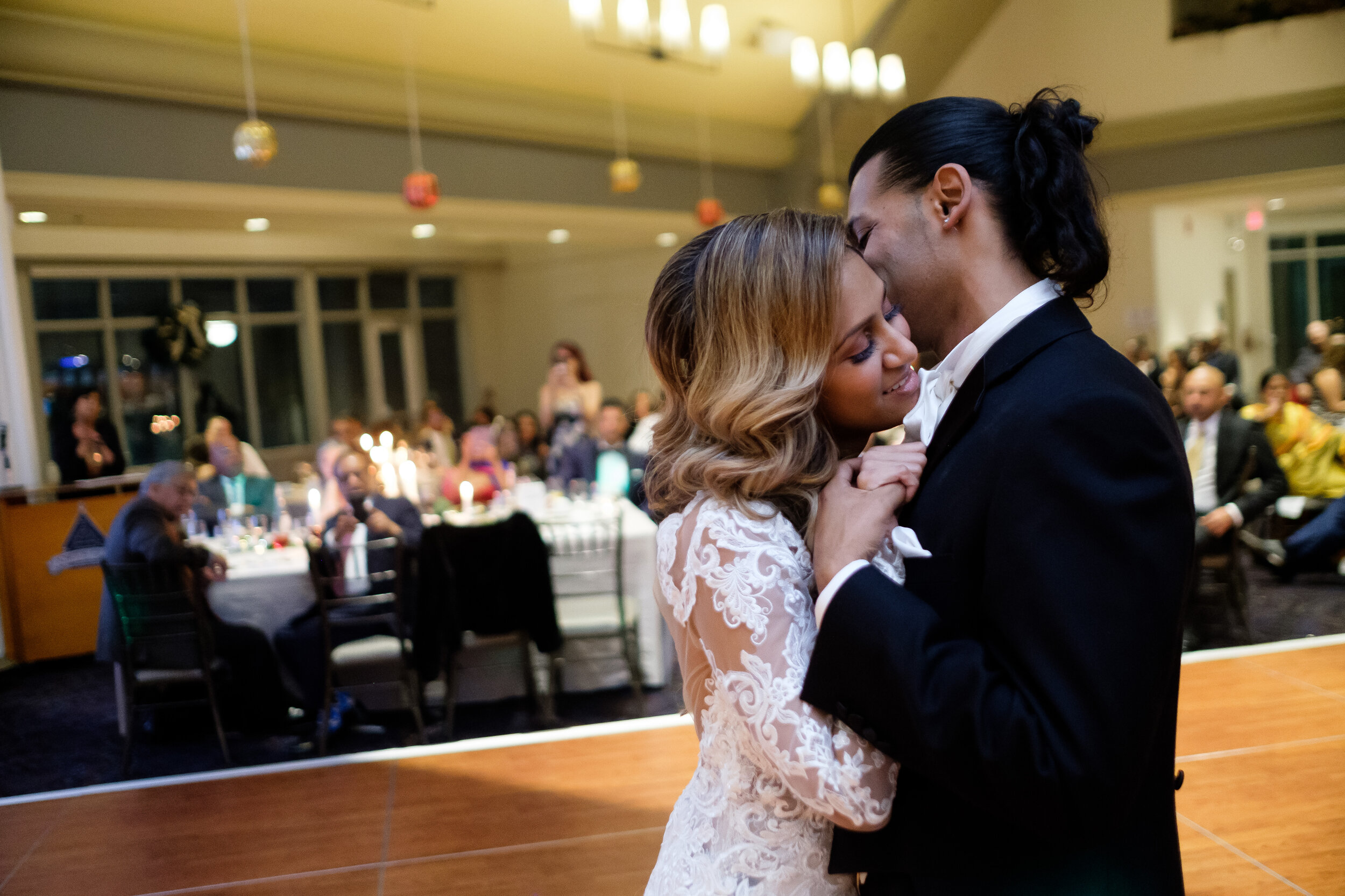  Anita + Gehan embrace during their first dance during  Anita &amp; Gehan’s winter wedding at Angus Glenn just outside of Toronto, Ontario. Wedding photograph by Scott Williams (www.scottwilliamsphotographer.com) 