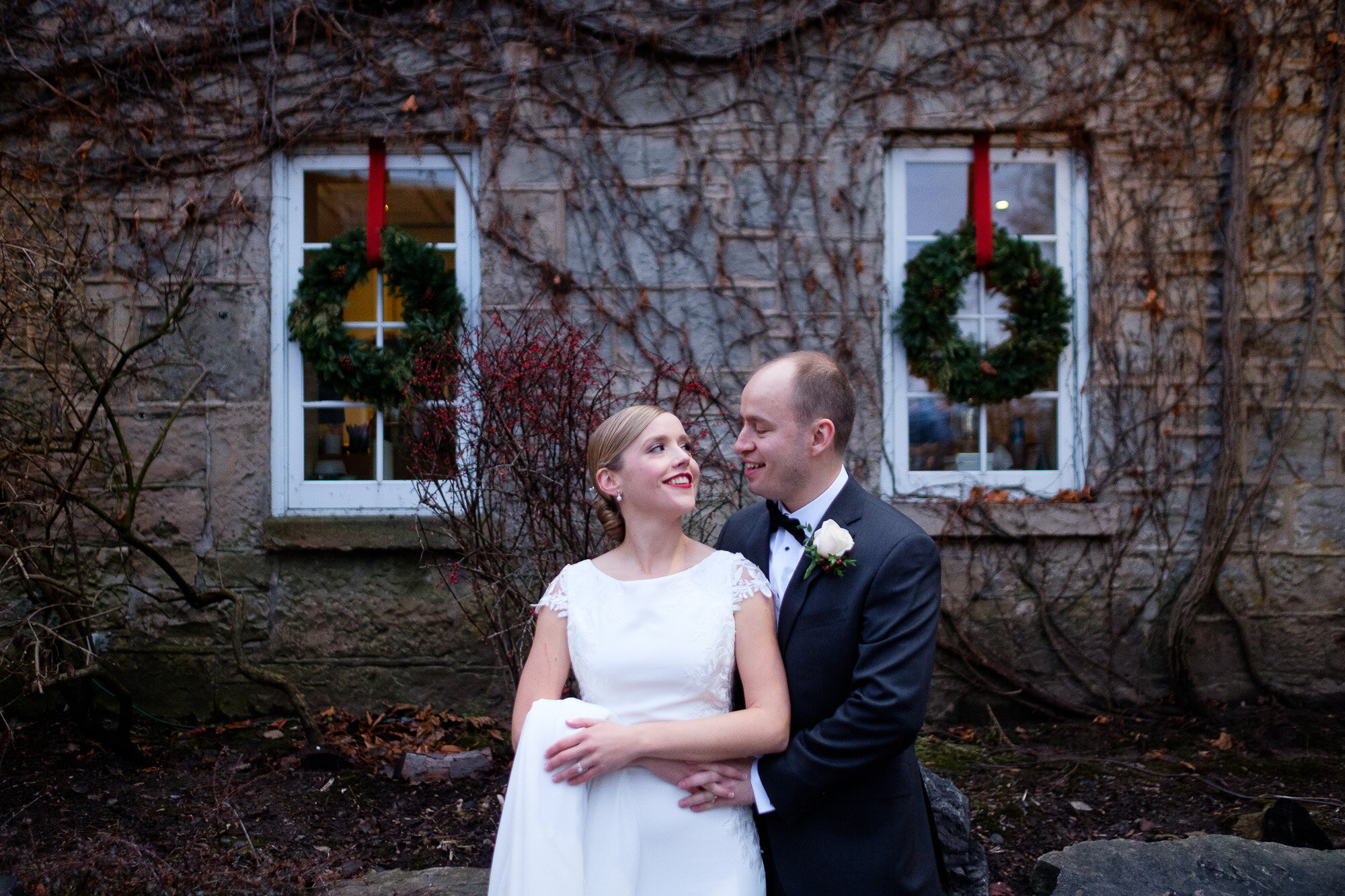  Lisa &amp; Tyler pose for a romantic portrait on the grounds of the Ancaster Mill during their winter wedding in Ancaster, Ontario.  Wedding photograph by Toronto wedding photographer Scott Williams (www.www.scottwilliamsphotographer.com) 