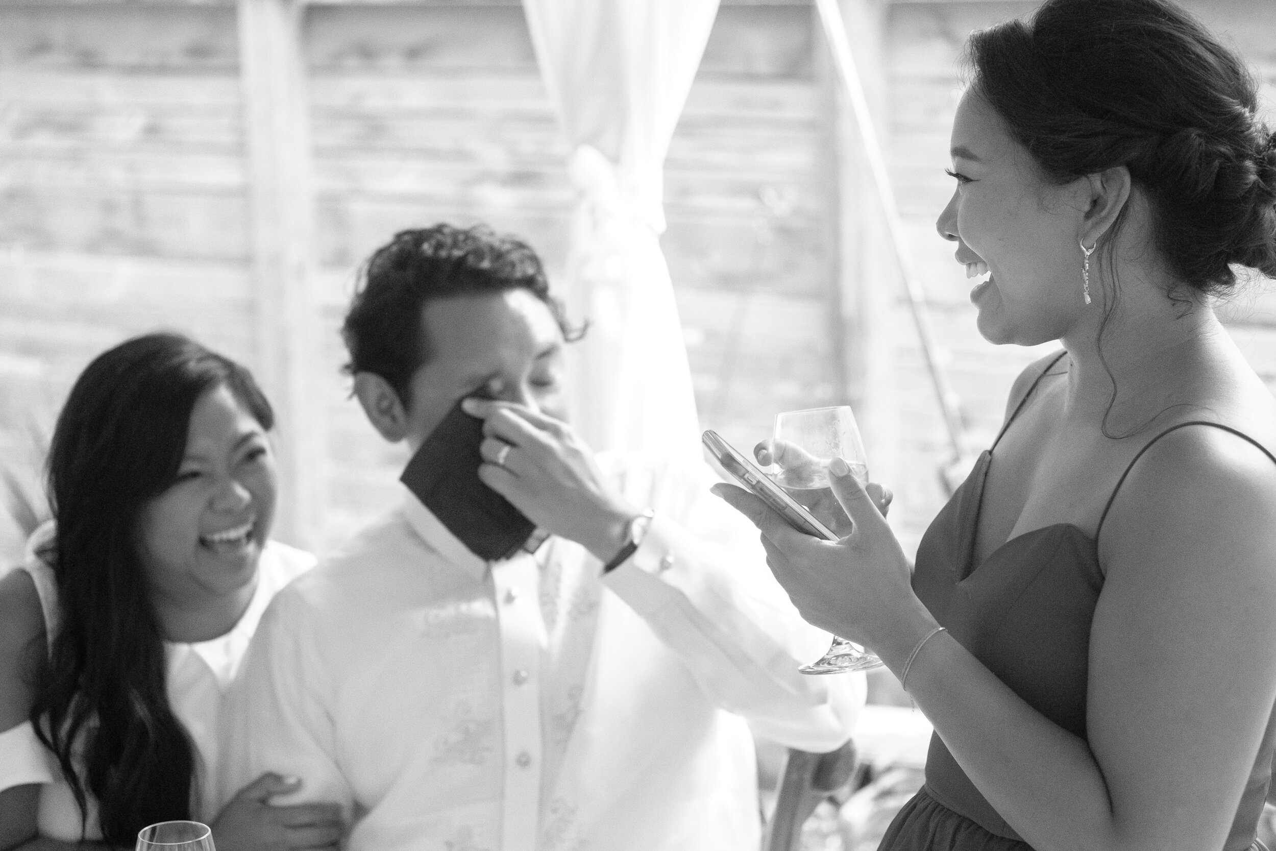  A candid black and white wedding photograph of a bridesmaid giving a speech during the reception at Geraldine &amp; Raphael’s backyard Toronto wedding by Toronto documentary wedding photographer Scott Williams (www.scottwilliamsphotographer.com) 