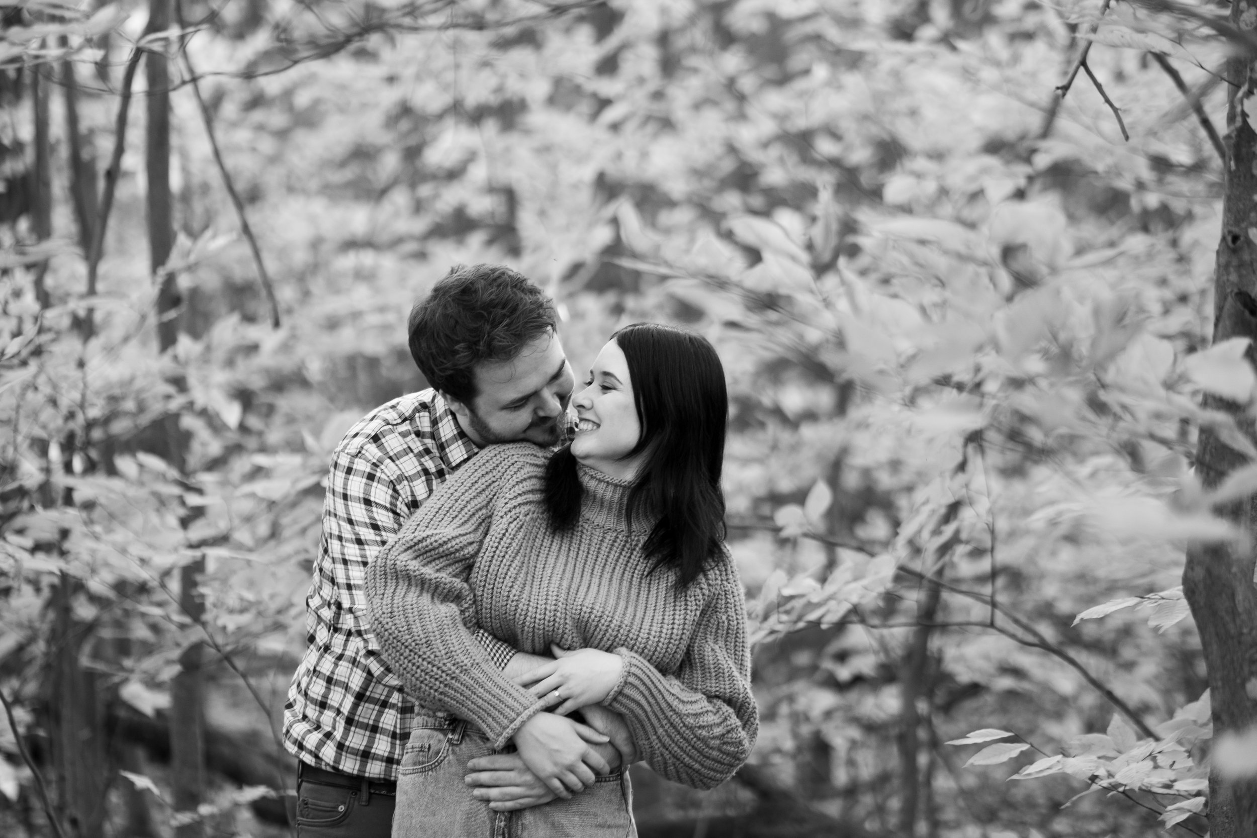  A black and white engagement photograph from Megan and Joshua’s engagement session at a nature trail in Cambridge, Ontario by Toronto wedding photographer Scott Williams. 