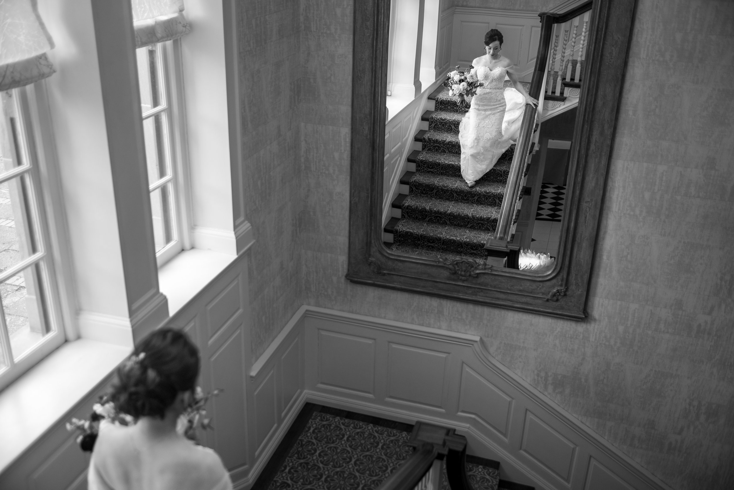  A candid wedding photograph of Jennifer on her way to see Jarvis for their first look  before their wedding later at Graydon Hall in Toronto, Ontario.  Photograph by Toronto Wedding Photographer Scott Williams. (www.scottwilliamsphotographer.com) 