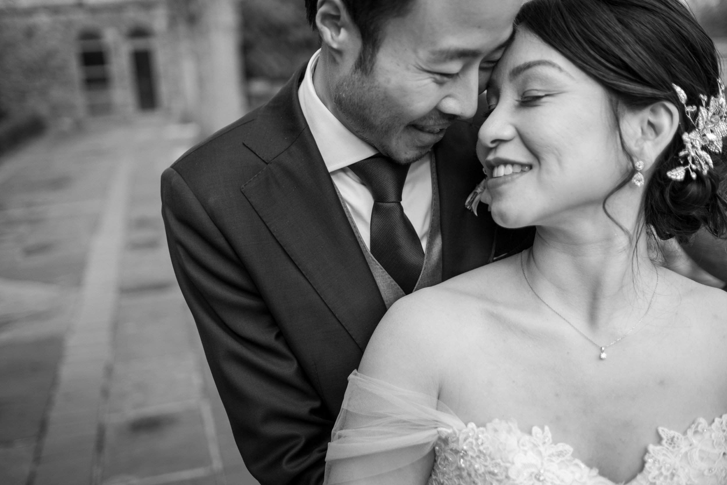  A black and white wedding portrait of Jennifer and Jarvis before their wedding reception later at Graydon Hall in Toronto, Ontario.  Photograph by Toronto Wedding Photographer Scott Williams.  